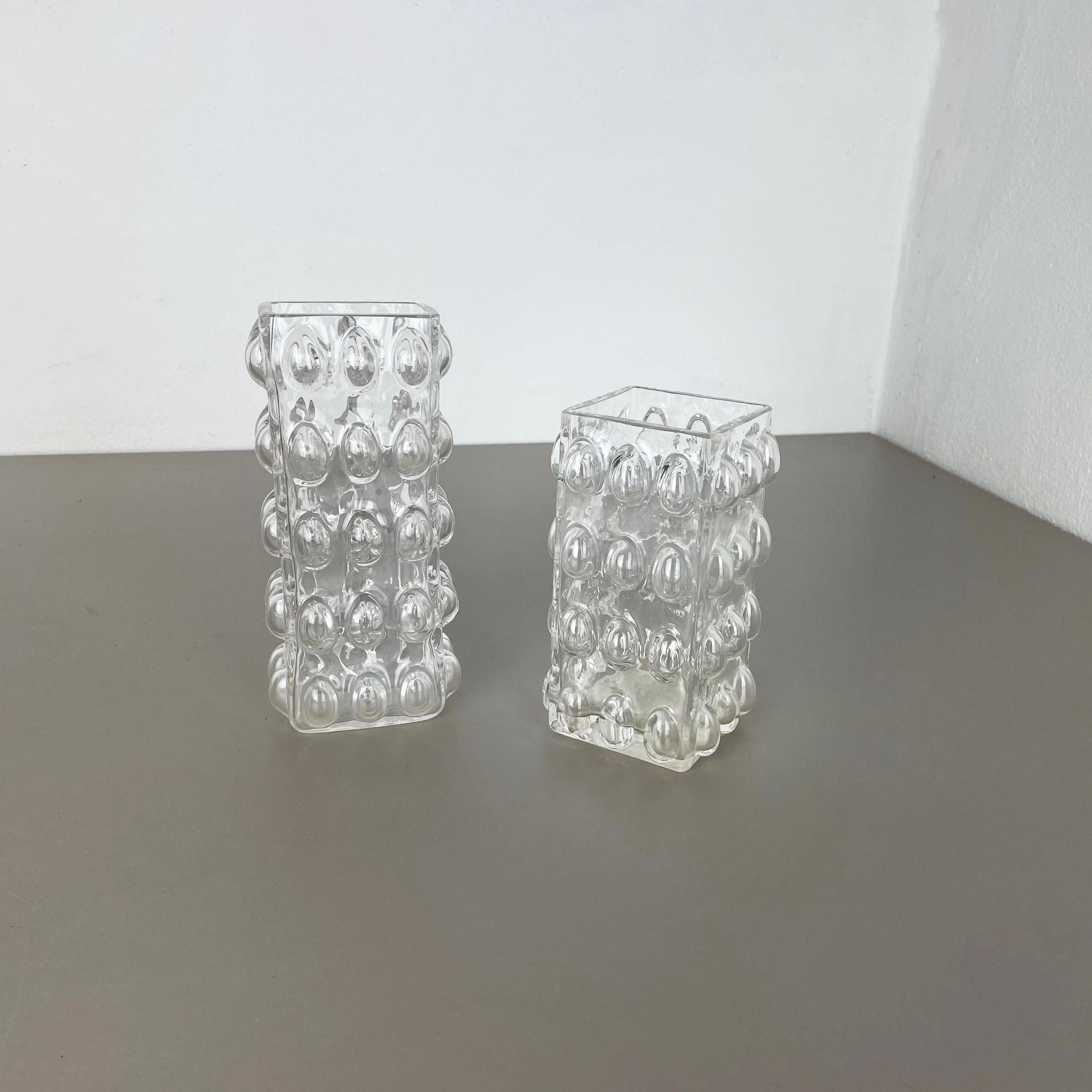 Article:

Set of 2 bubble vases


Producer:

Hirschberg, Germany


Design:

Wilhelm Braun-Feldweg



Decade:

1960s




Original vintage 1960s set of 2 vases of the Braun-Feldweg bubble glass vase series. These two vase are