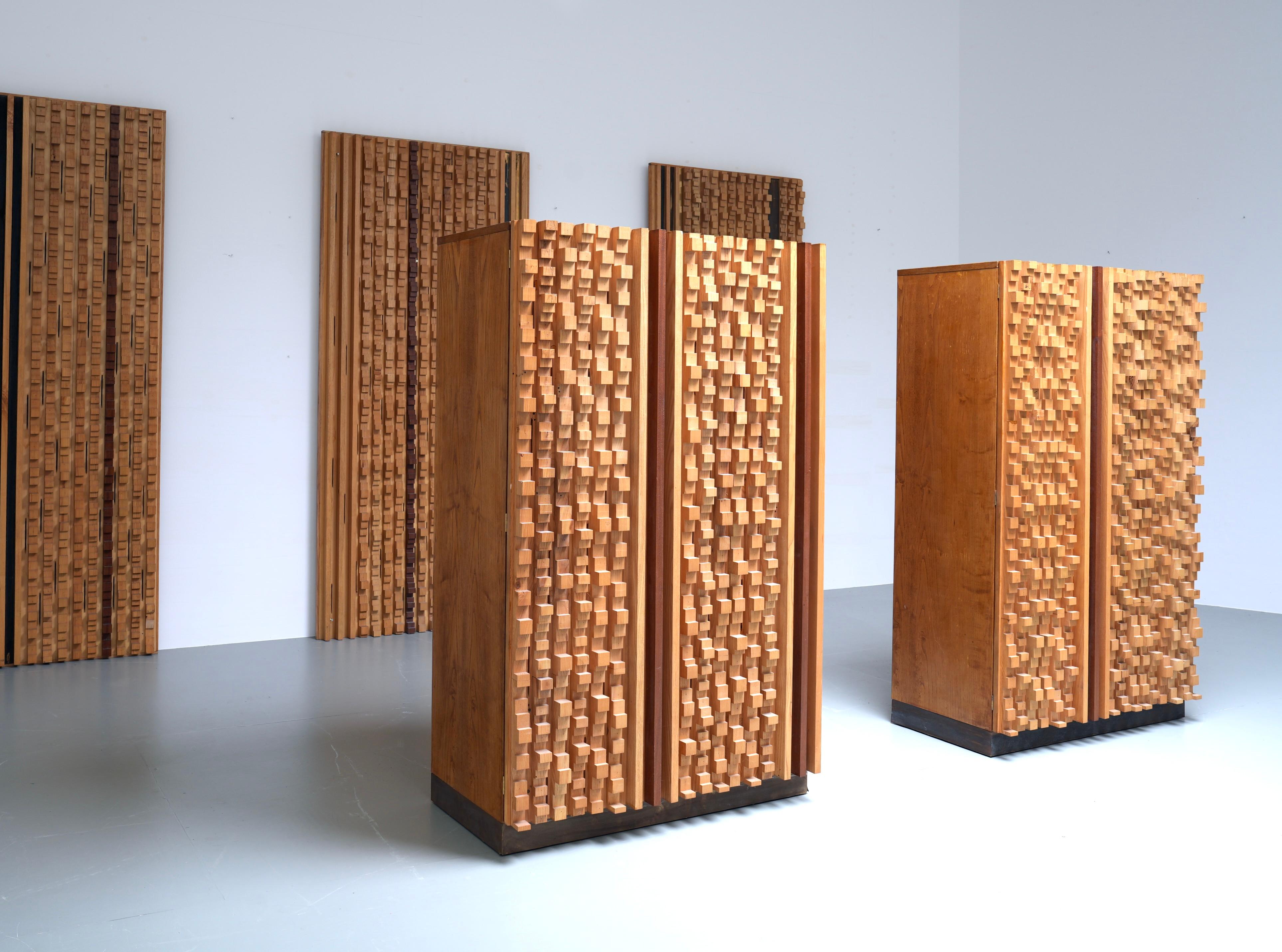 Unique and custom built set of 3 Wall Panels and 2 brutalist Cabinets by the Italian sculptor Stefano d’Amico in ash and brass, signed and dated, 1974.

There is not so much known about D'Amico's work apart from that he held expositions in Milan and