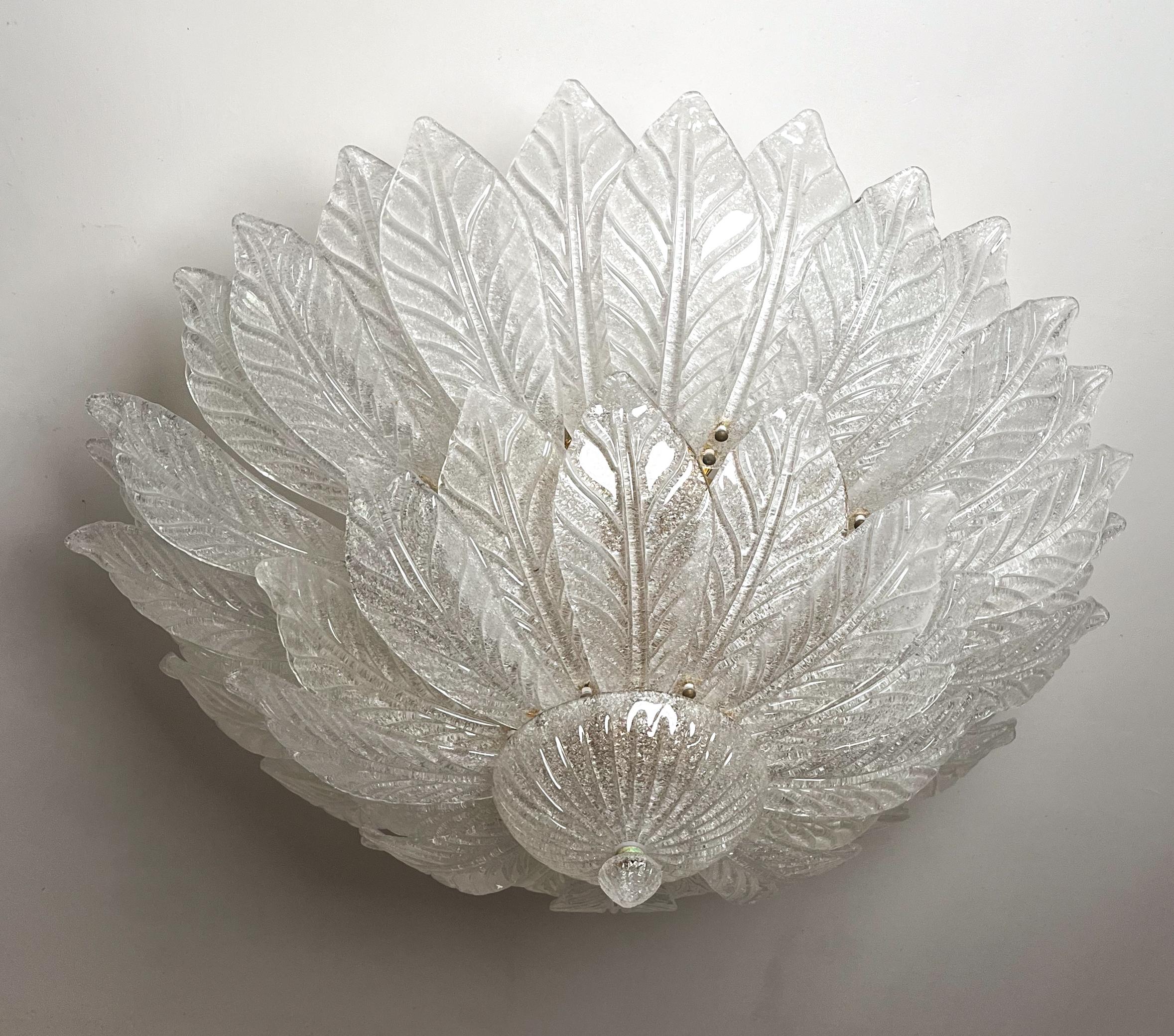 Set of 2 Large and elegant built-in Murano glass chandelier in neoclassical style, Italy, circa 1970s.
The Murano chandelier, in the Mid-Century Modern style, is composed of two layers of transparent leaf glass and a gold frame.
The two layers are