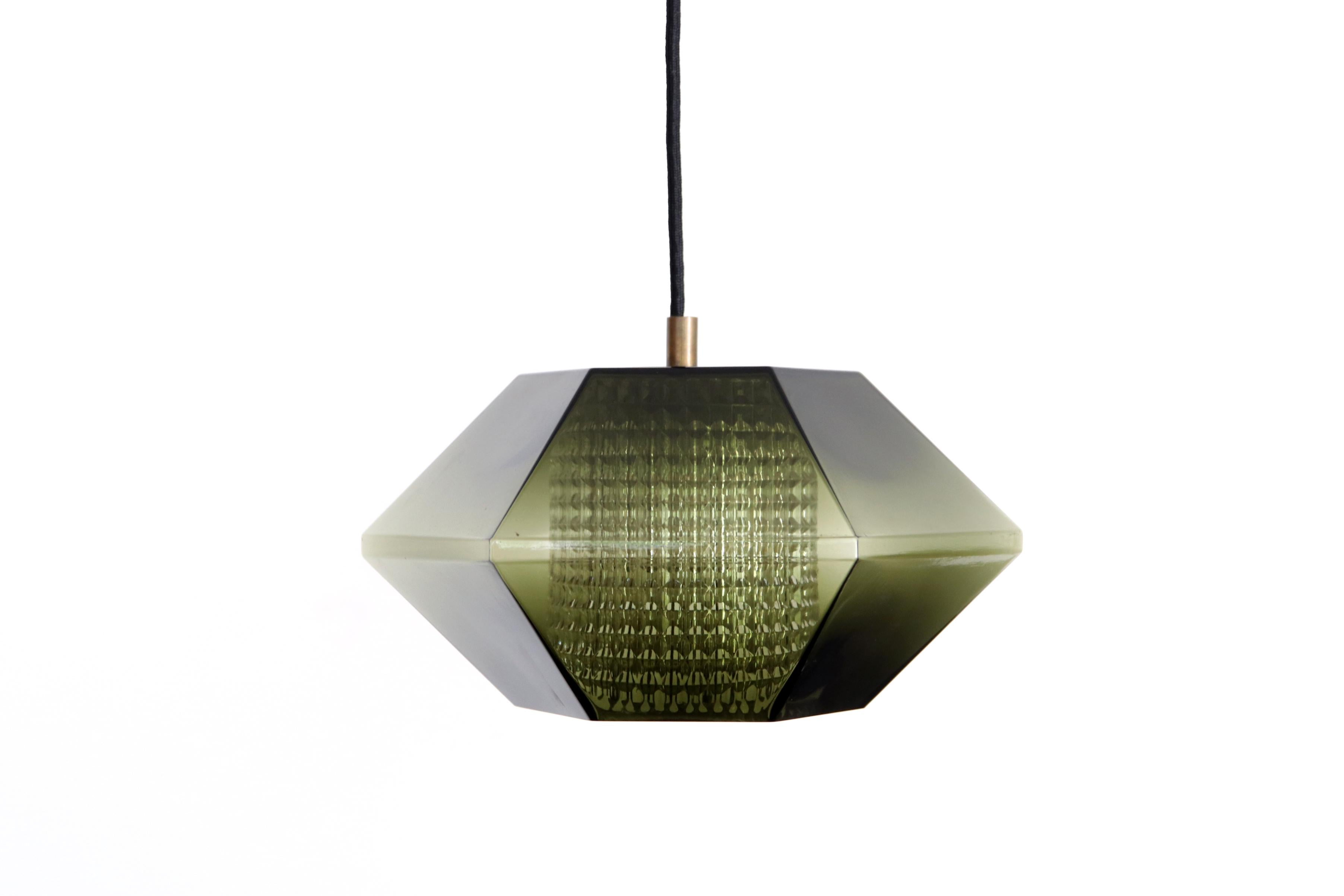 Special set of lamps by Carl Fagerlund for Orrefors from Sweden. The lamps have a beautiful hexagonal shape of beautiful dark green glass, with a cylindrical crystal glass diffuser inside. The lamps have brass details. In short, a beautiful and rare