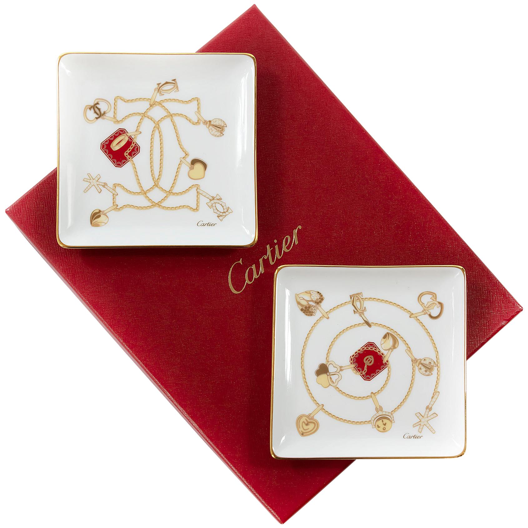 Set of 2 Cartier porcelain small jewelry plates in original Cartier box.
  