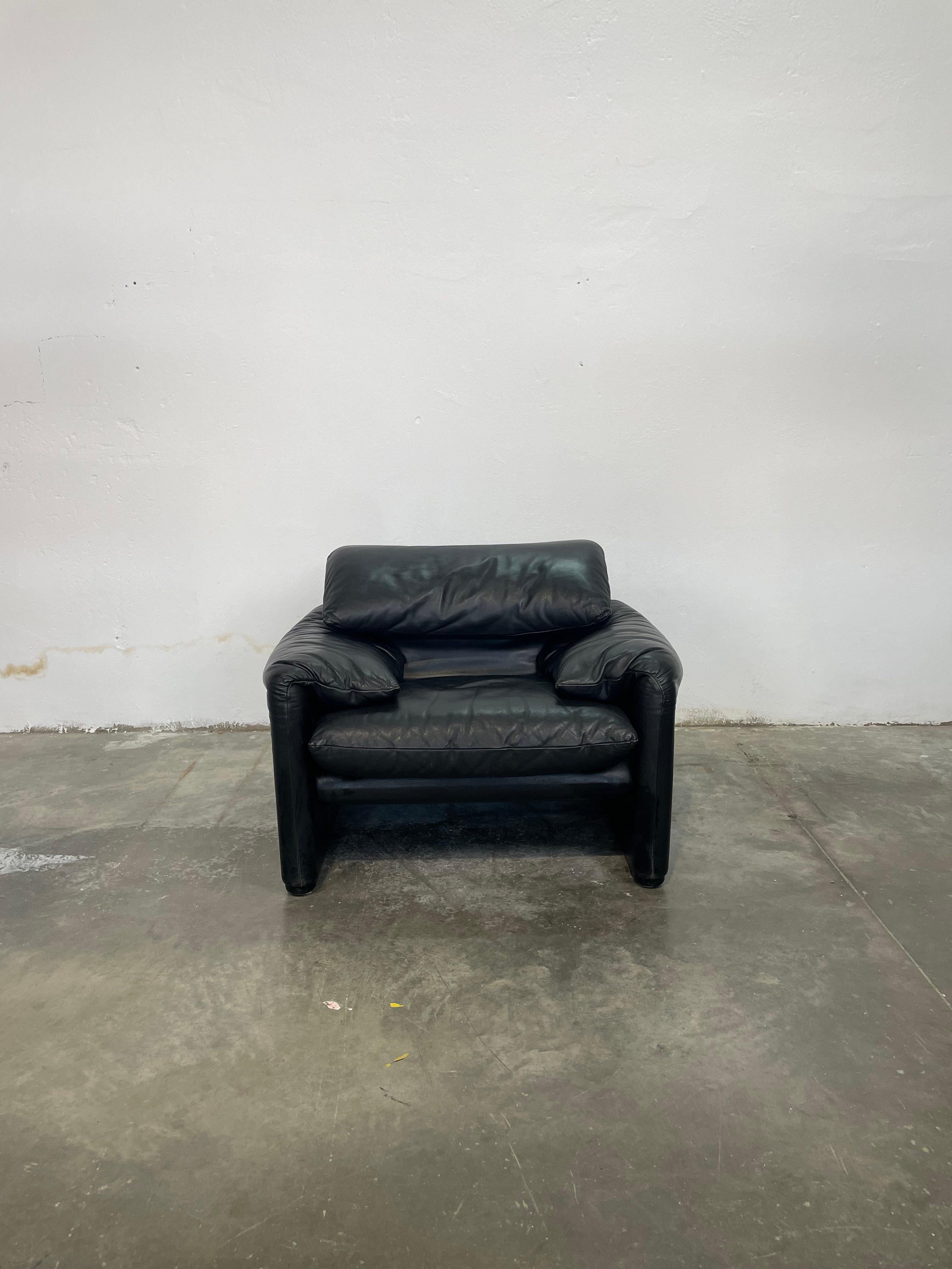 A breathtaking pair of vintage Maralunga armchairs by Vico Magistretti for Cassina, exquisitely upholstered in rich black leather. Introduced in 1973, these iconic chairs embody the perfect fusion of Italian craftsmanship and innovative design. The