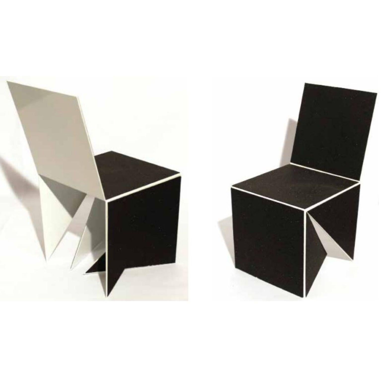 Set of 2 Casulo cubes #2 by Mameluca
Material: electrostatic sluminum paint, recycled rubber blanket.
Dimensions: D 45 x W 45 x H 90 cm

Opening a cube and transforming it into a plan was the starting point for the creation of this trio of
