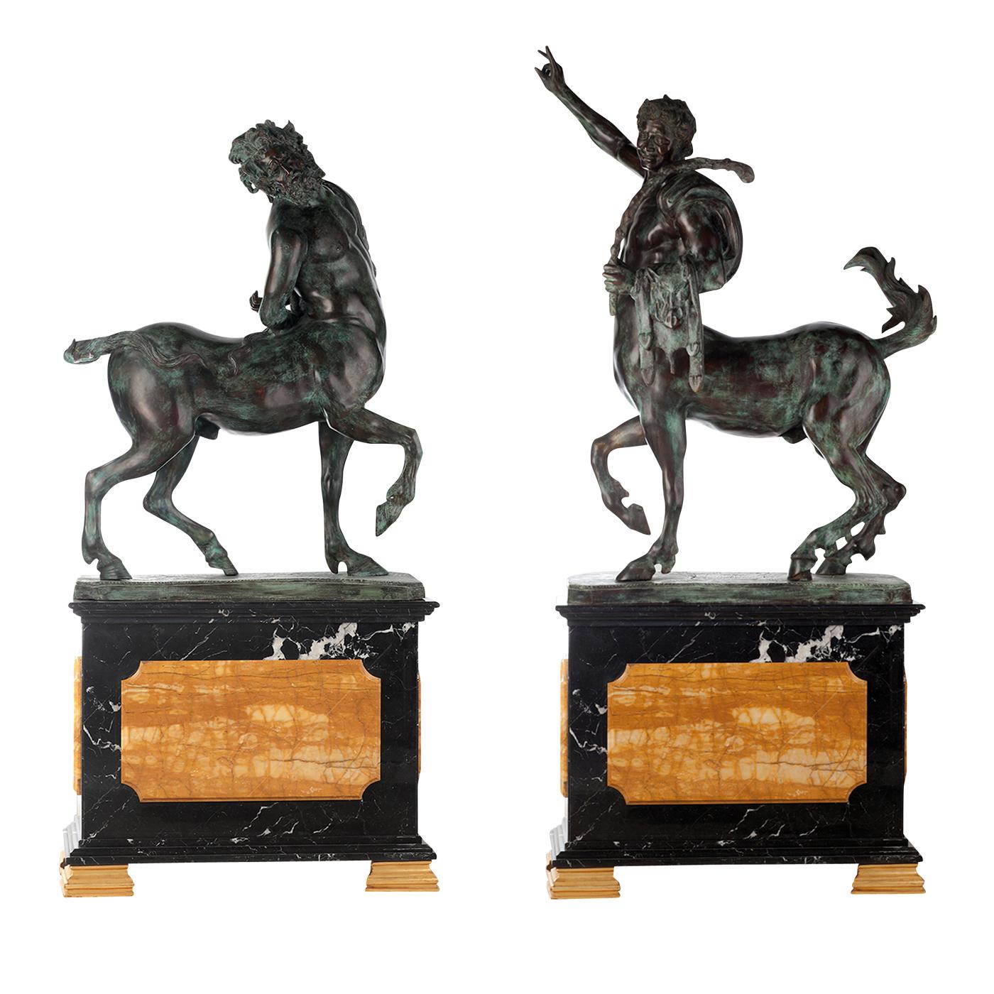 These two statuettes are inspired by ancient mythology and depict the traditional centaur, half man and half horse. Each statue rests on a classically-shaped pedestal in black marble with striking inserts and feet in yellow marble. The bronze