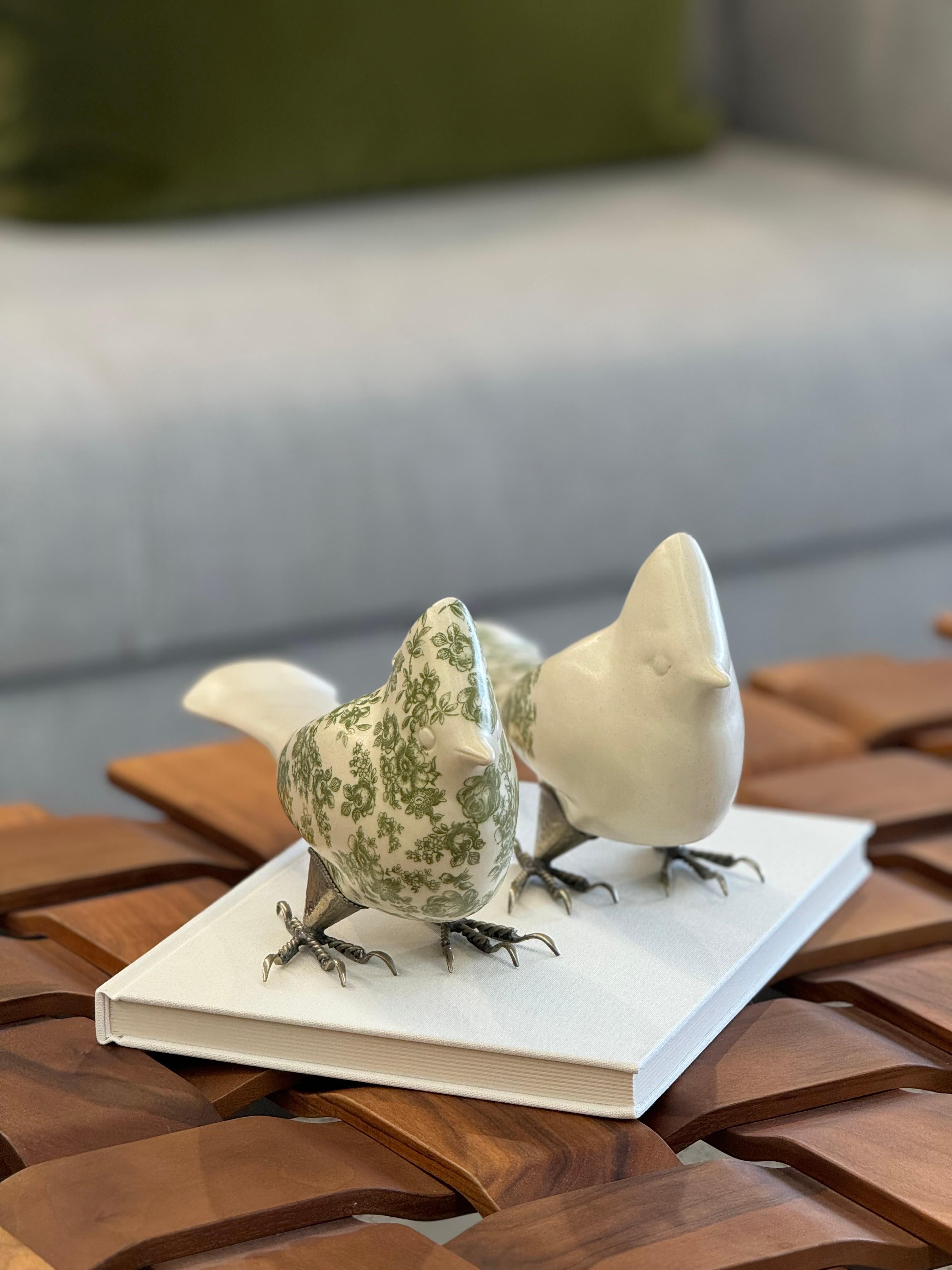 Hand-made, exquisite set of two ceramic cardinal birds created in Tonala, Jalisco, Mexico. Each piece is meticulously handcrafted, showcasing stunning floral design that highlights the vibrant artistic traditions of Mexico.