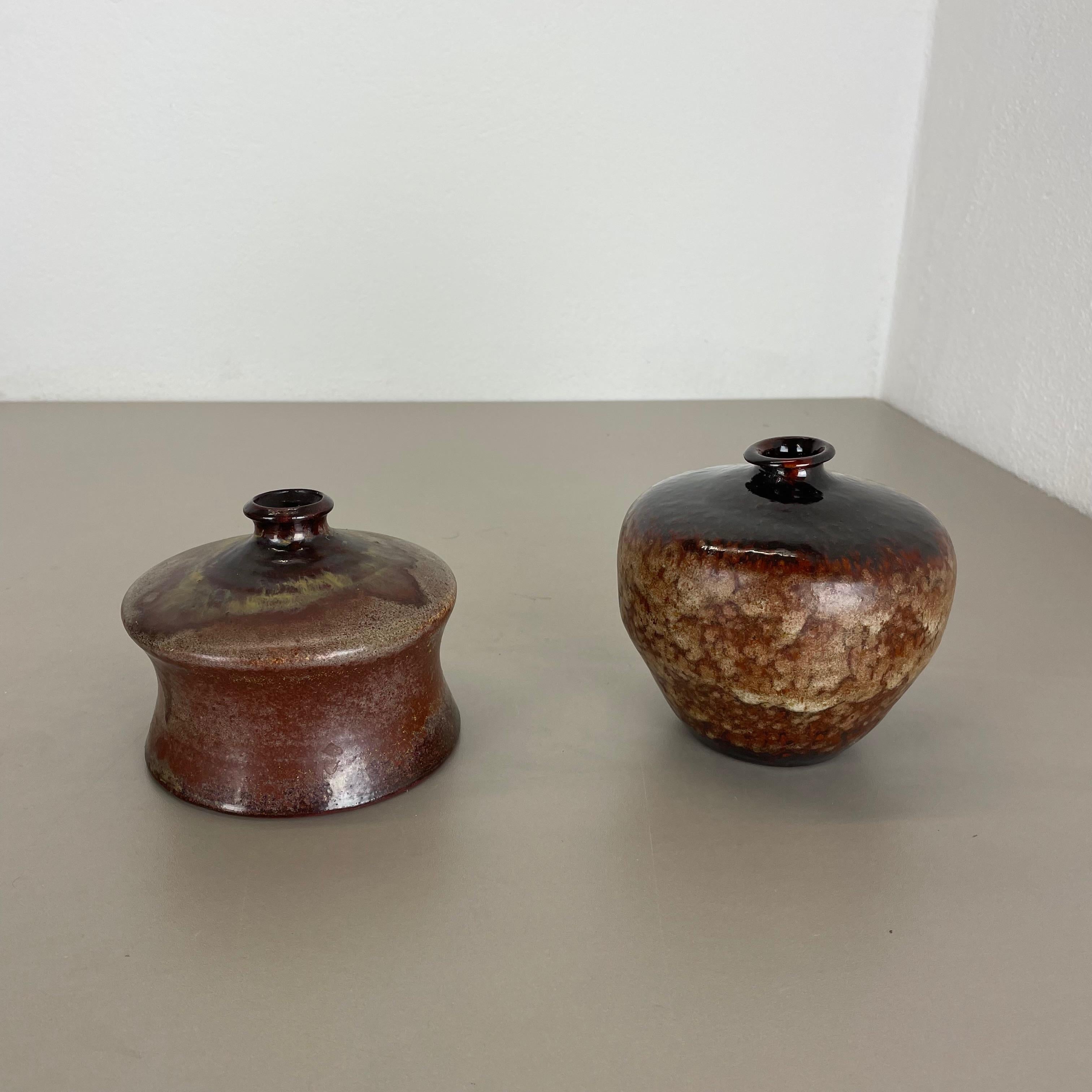 Article:

Ceramic vases set of 2


Producer:

Elmar & Elke Kubicek , Germany


Decade:

1970s



This original vintage Studio Pottery Object was designed by Elmar and Elke Kubicek and produced in their own Studio in the 1970s in
