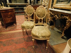 2 Stühle aus vergoldetem und geschnitztem Holz, Italien