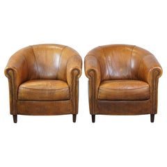 Set of 2 charming, sturdy, and comfortable sheepskin leather club armchairs