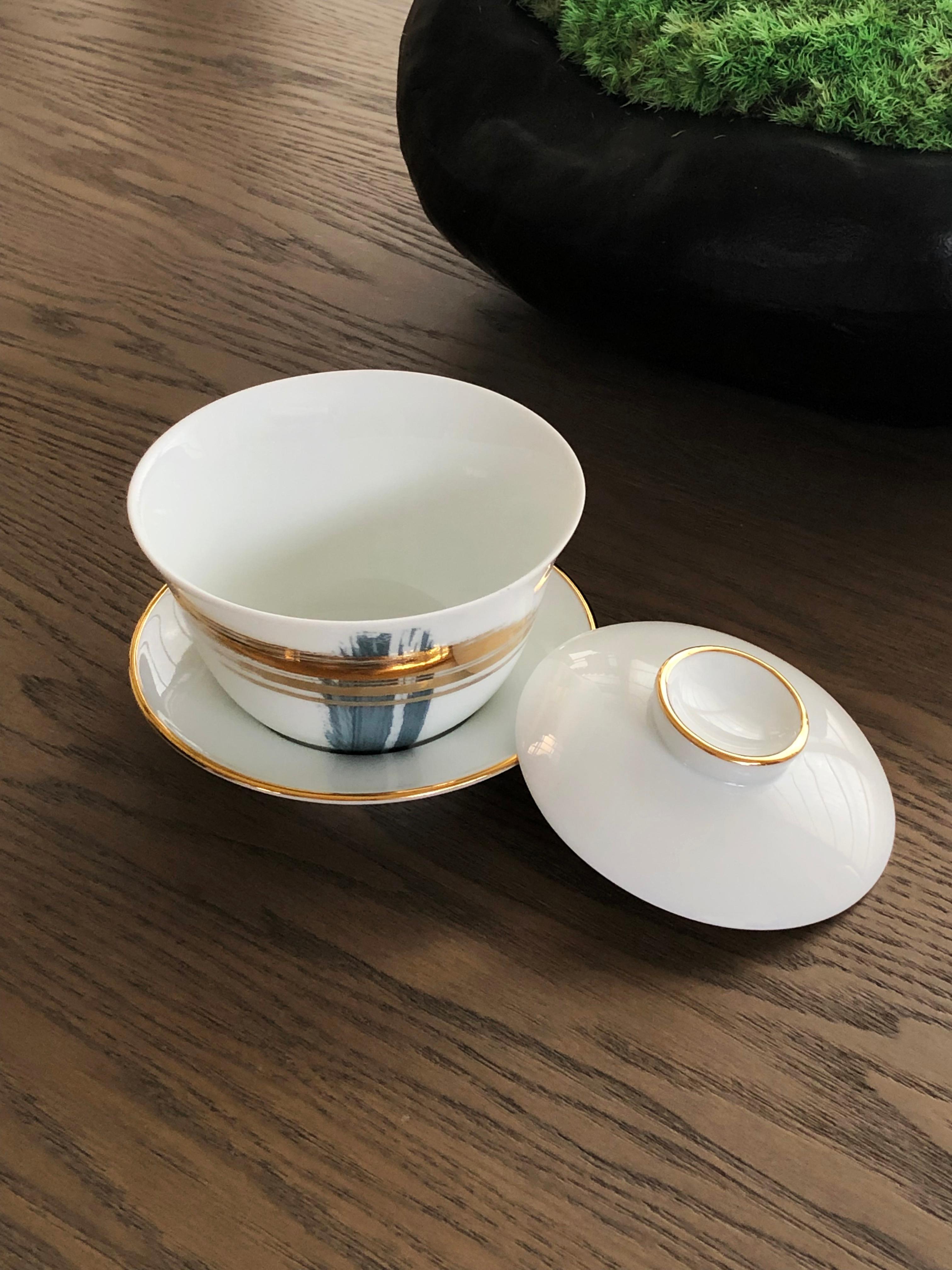 Larger quantities available upon request, with 8 weeks production time.

Description: Chinese tea cup gaiwan set (2 pieces)
Color: Blue and gold
Size: 11 Ø x 10 H cm, 225 ml
Material: Porcelain and gold
Collection: Artisan Brush