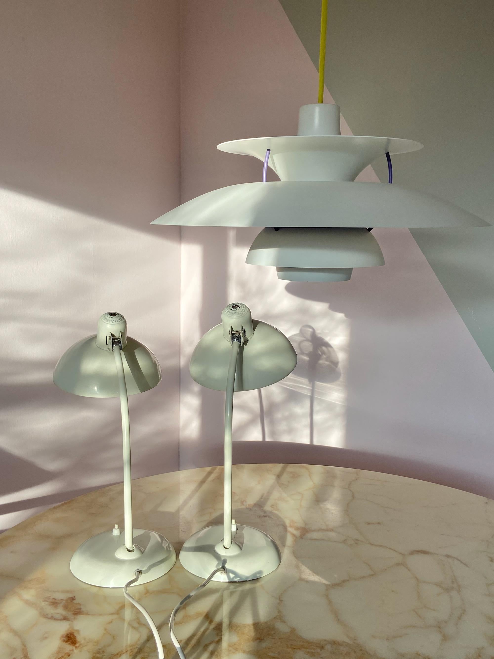 Set of 2 Christian dell desk lamps model 6556 for Kaiser Idell, Germany. Arm and shade adjustable. With E26/27 Edison screw socket. 
The lamps are since the beginning together so they are from the same production date, in the same white color and