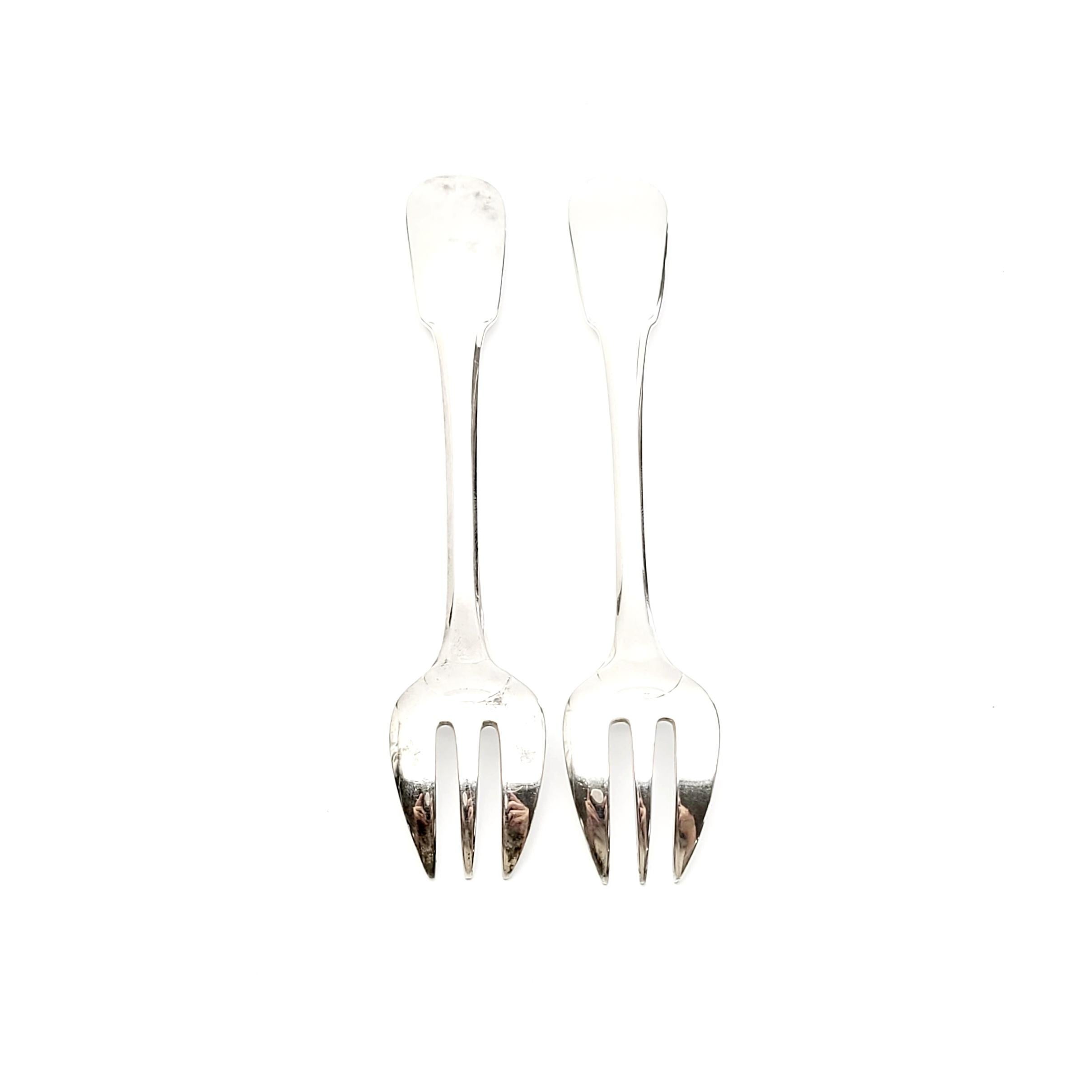 Set of 2 vintage silver plate oyster forks in the Cluny pattern by Christofle.

The Cluny pattern is a simple and elegant design named for the medieval abbey.

Measures: 5 3/4