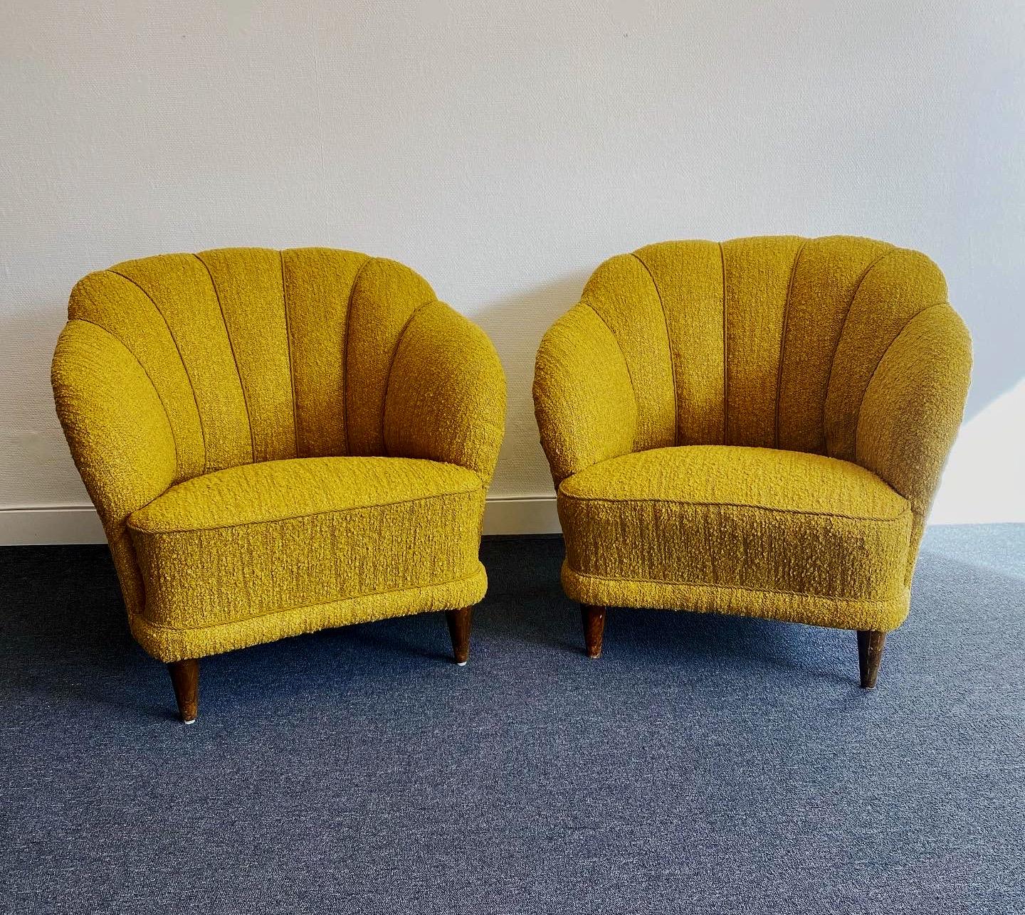 A pair of club chairs attributed to Carl-Johan Boman (Finnish 1883-1969), Circa 1940s. Probably produced by Oy N. Boman AB, Turku, Finland. 
Exclusive and extremely comfortable chairs with generous armrests and curved, encompassing shell-shaped