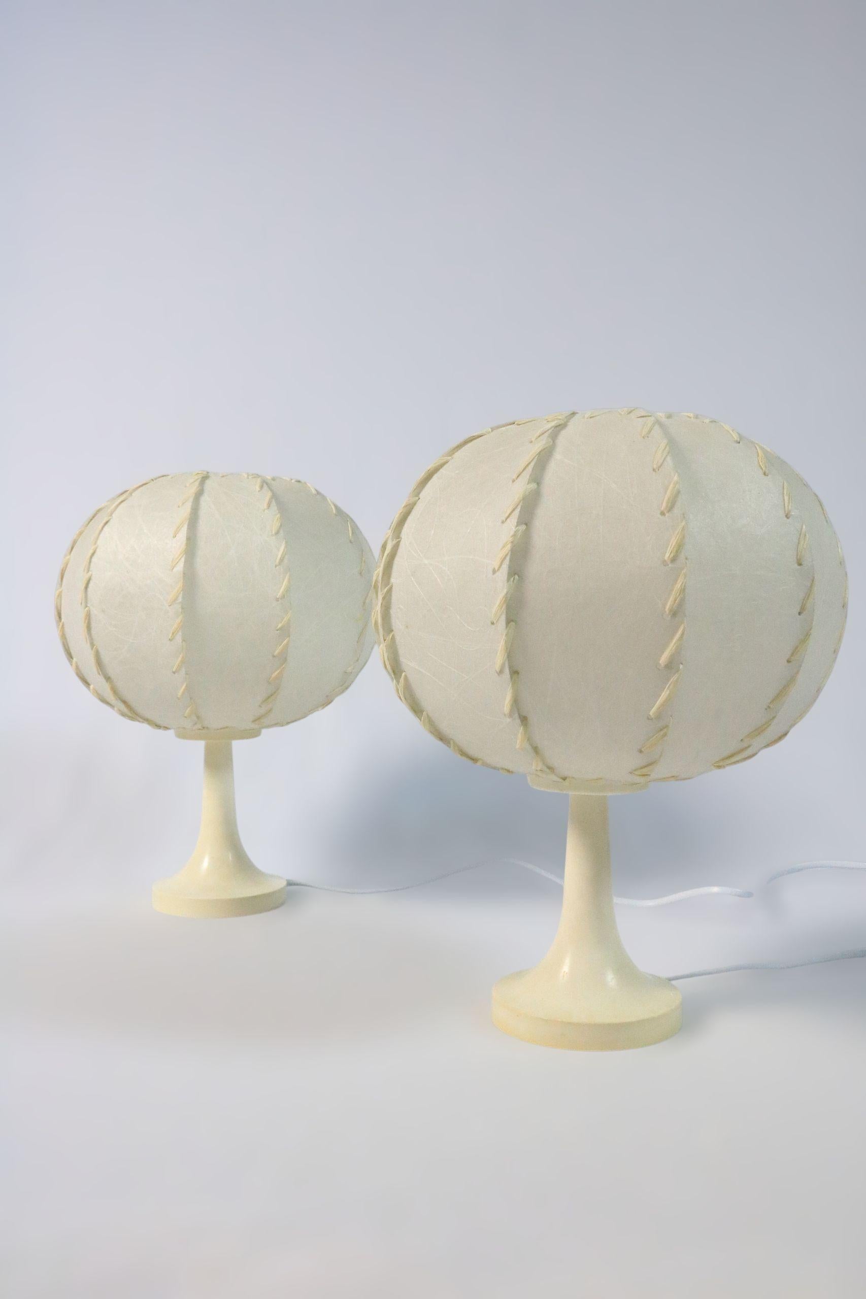 Set of two very decorative small table lamps.
Original fron the 1970s, by Goldkant Leuchten Germany.
Great lighting atmosphere.

The material of the lampshades is spray resin, typical for this time. And well known from Achille Castiglionis Taraxacum