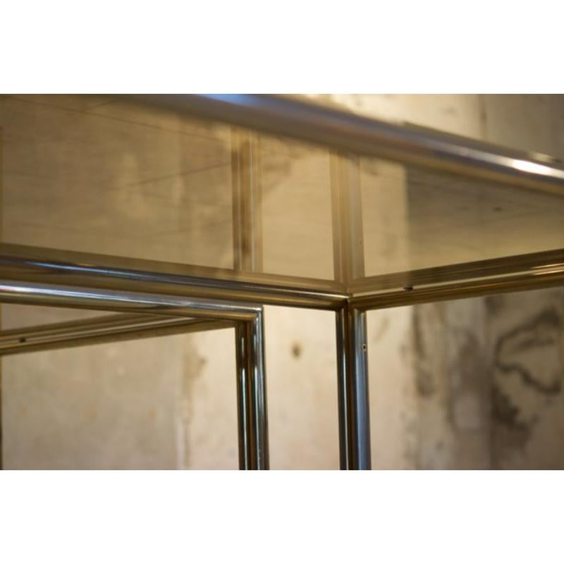 Coffee Tables in Aluminum, Brass & Glass, 1970s Set of 2

Vintage Design
Pair of designer coffee tables 1970s, restored, in perfect condition.

Additional information: 
Materials: Aluminum, Brass, Glass
Color: Grey, Clear
Design Period: 1970 to