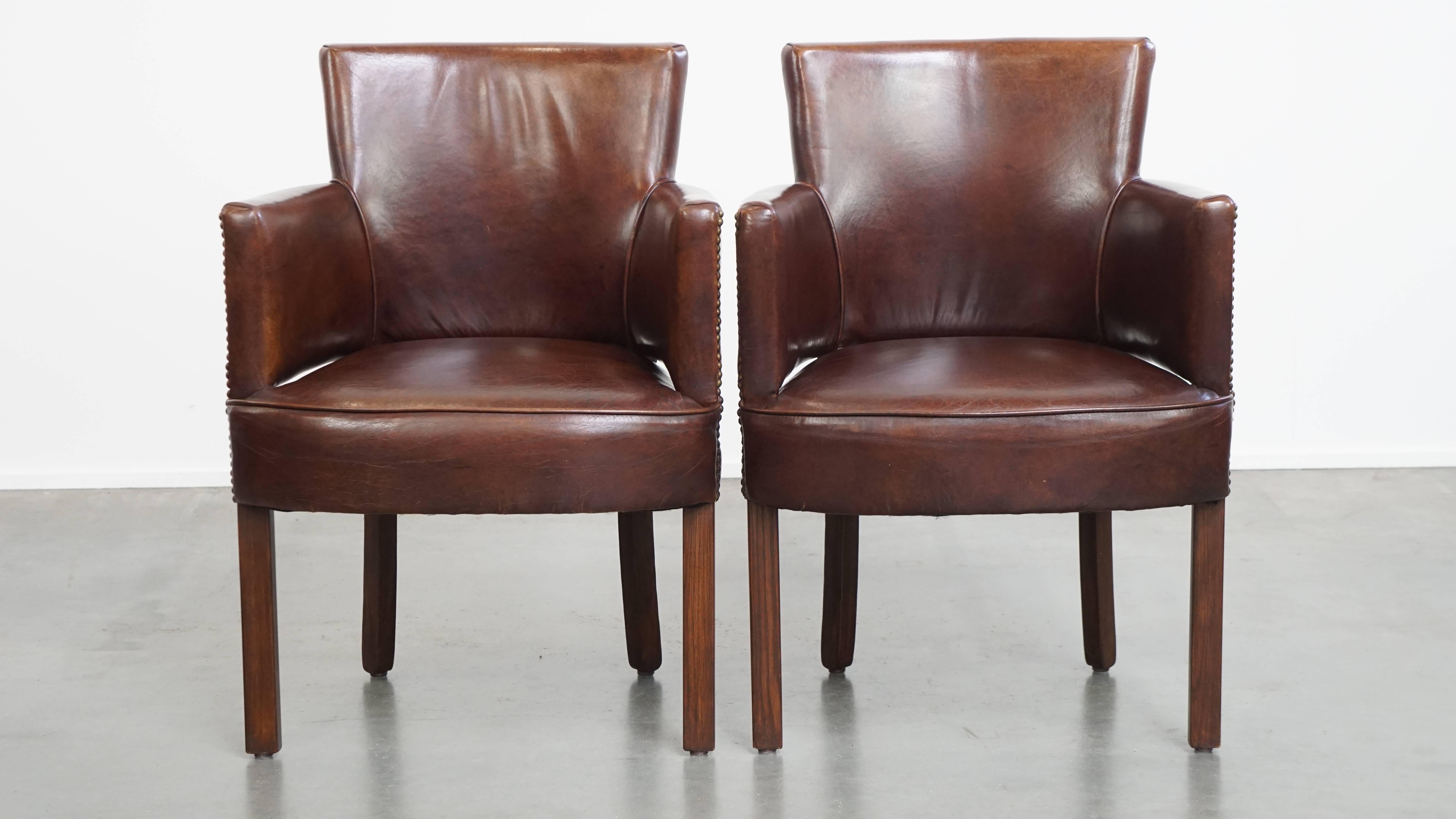 Offered here is a stunning set of 2 cognac-colored cowhide leather Ralph Lauren design dining chairs. This unique designer set by Ralph Lauren is crafted from high-quality cowhide leather and features an elegant, timeless design.

Thanks to their