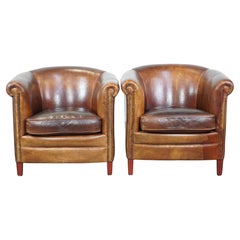 Set of 2 cognac-colored sheepskin club chairs
