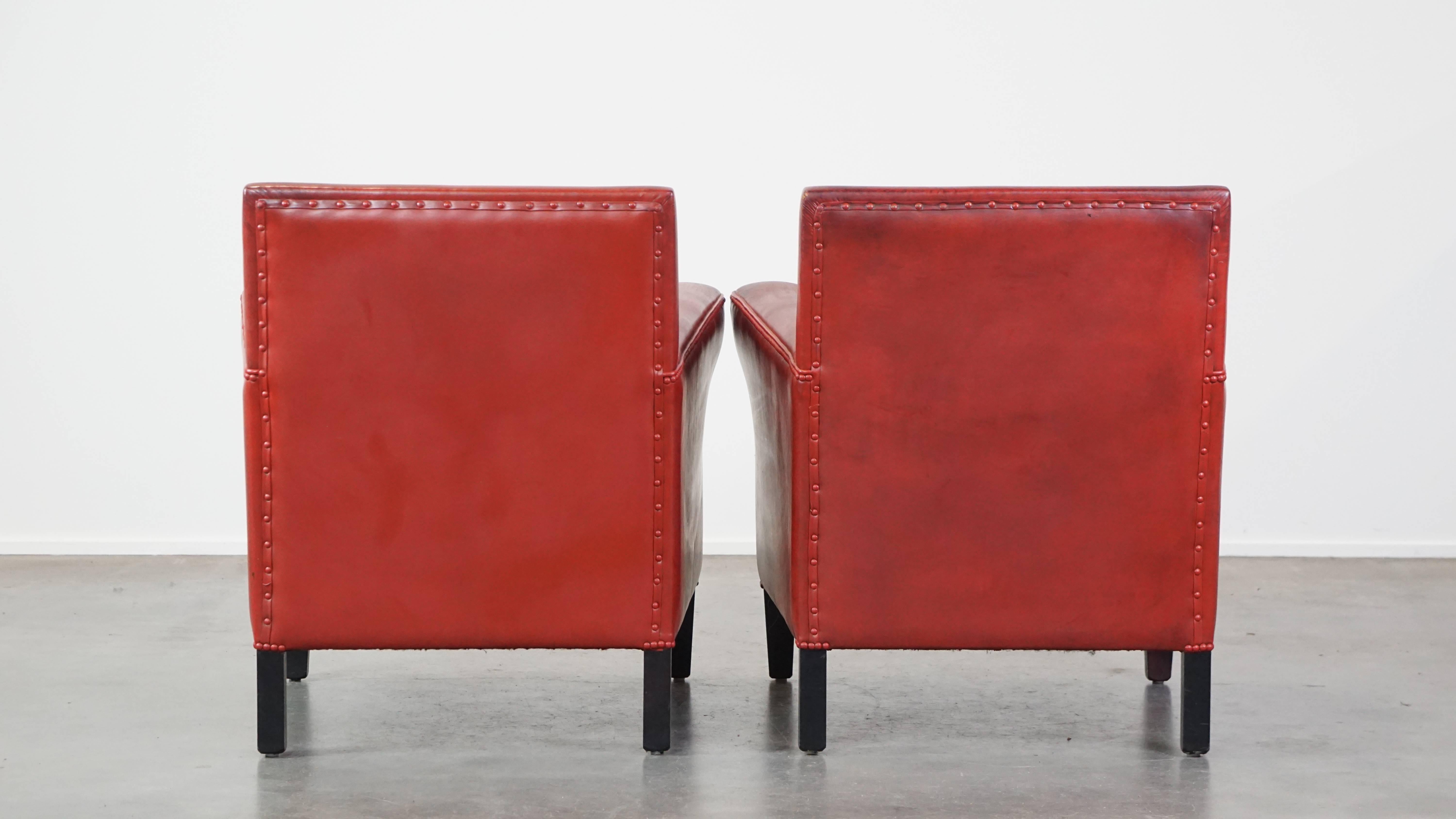 Hand-Crafted Set of 2 comfortable, unique, stylish, red-colored sheepskin design armchairs For Sale