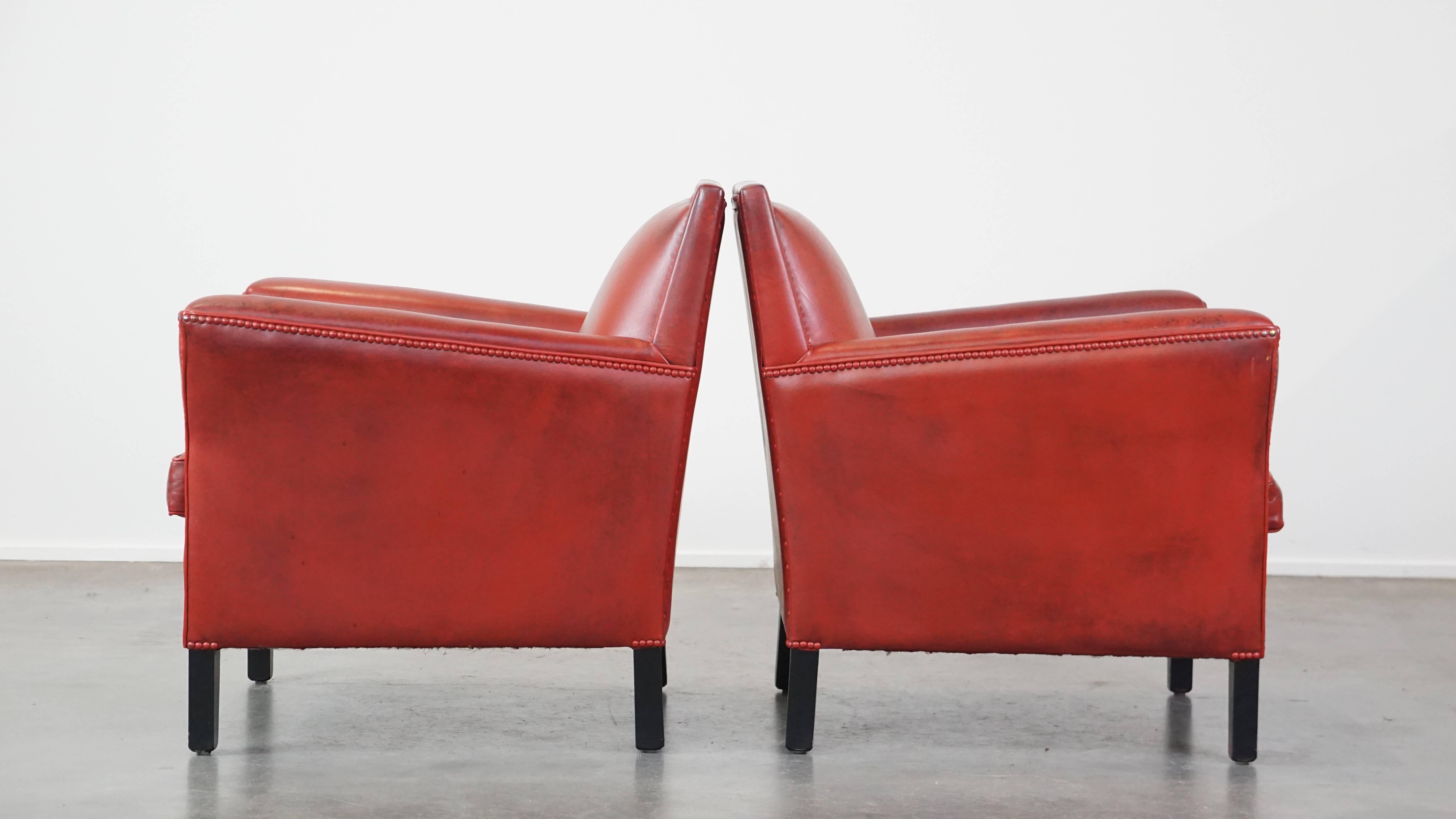 Set of 2 comfortable, unique, stylish, red-colored sheepskin design armchairs In Good Condition For Sale In Harderwijk, NL