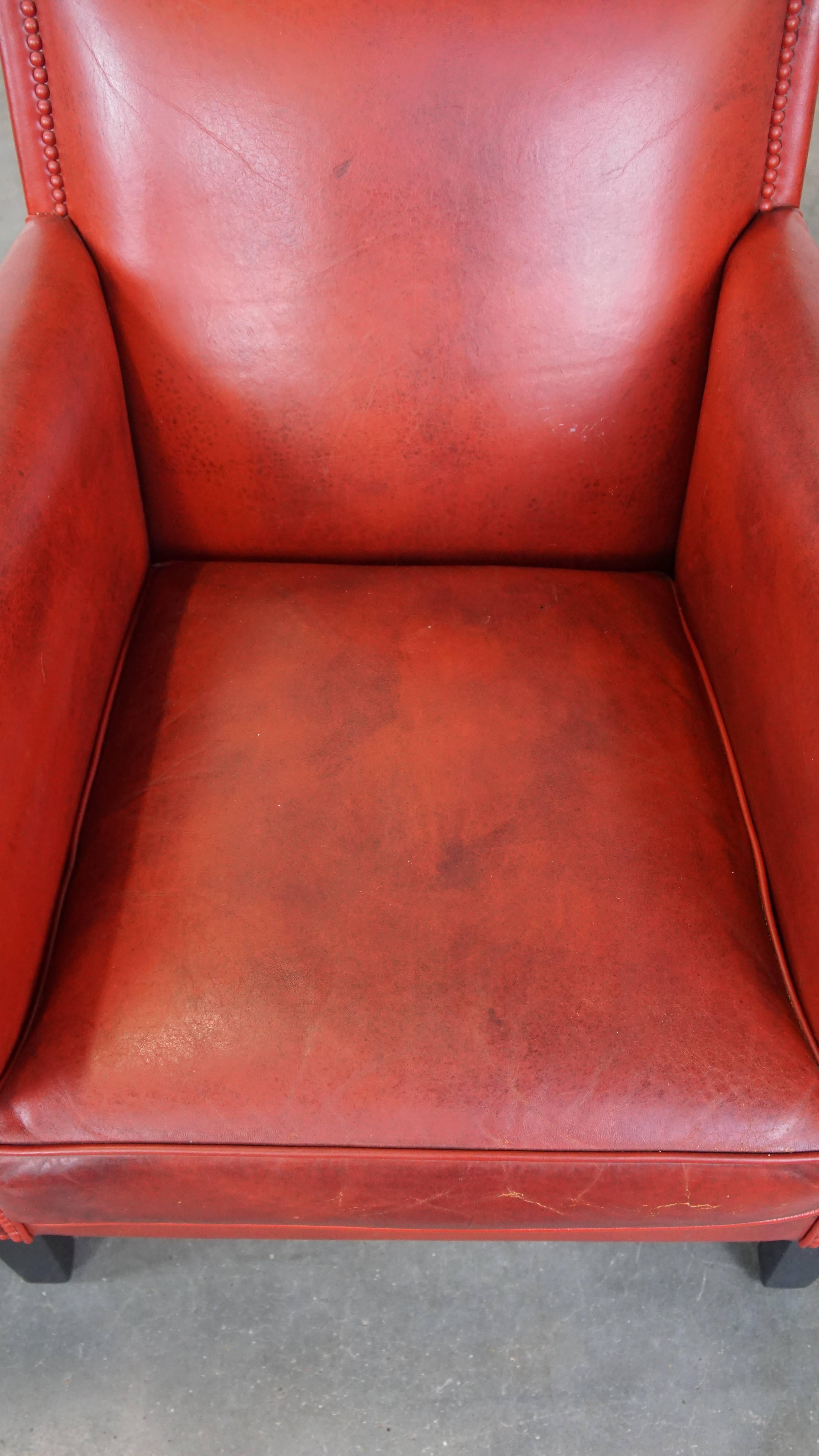 Sheepskin Set of 2 comfortable, unique, stylish, red-colored sheepskin design armchairs For Sale