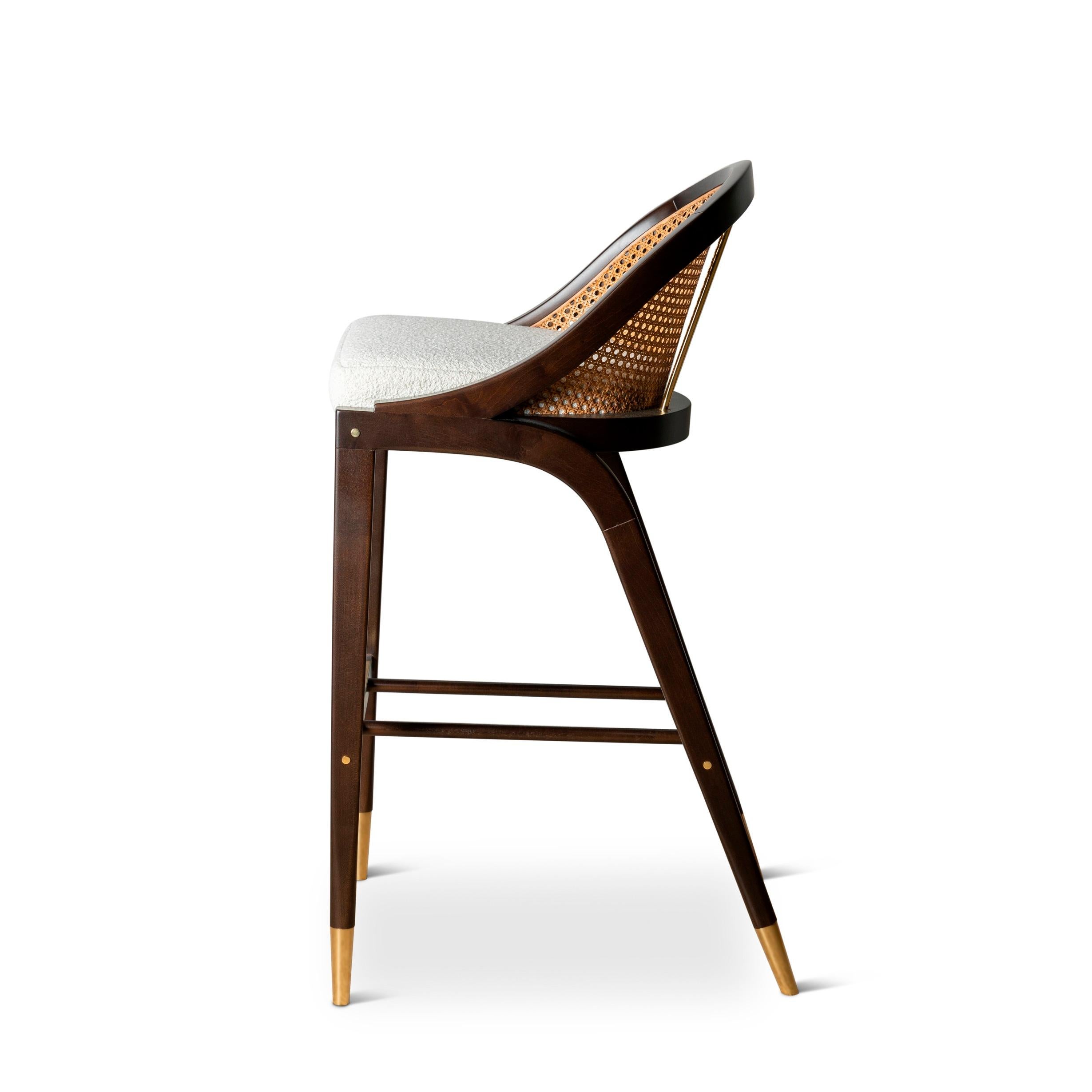 With a hint of retro, the design of this stool is inspired from the 1950s and the modernist movement of that period.
W 51cm  20”
D 56,5cm  22”
H 101.5cm  40”
SH 79cm  31”
Materials: Ebony stained wood, natural cane, polished