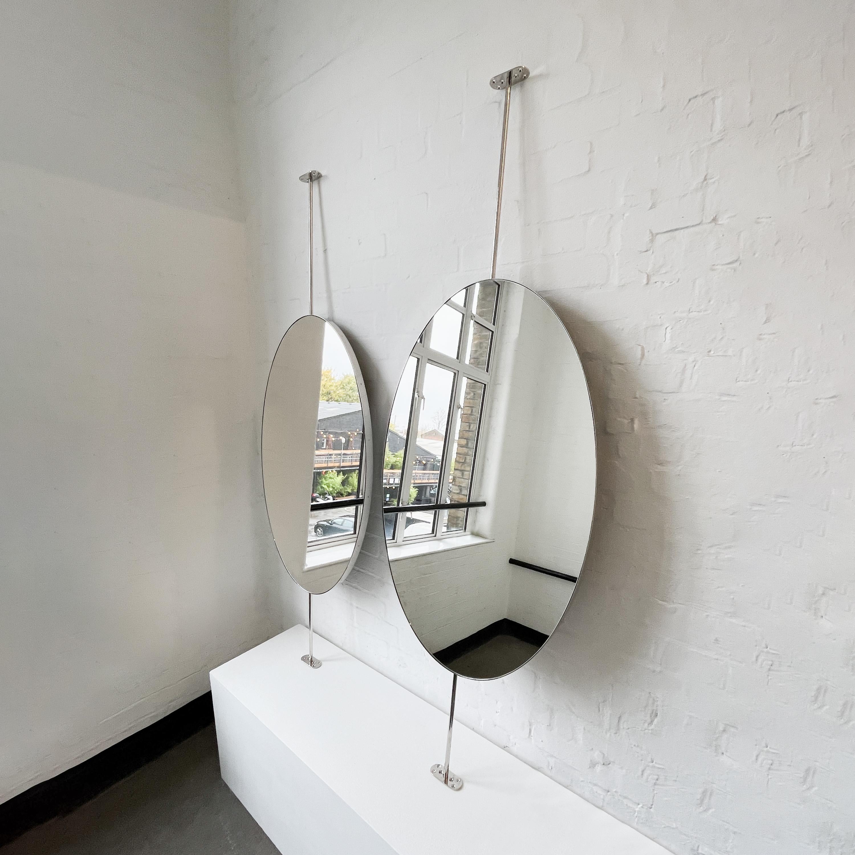 Set of 2 countertop to ceiling attached oval mirrors with an exquisite nickel plated frame. Designed and handcrafted in London, UK.

Dimensions:

W 62cm x H 120cm x Overall Depth 10cm (Drop 51cm, Rise 30cm )
W 47.2in x H 24.41in x Overall Depth