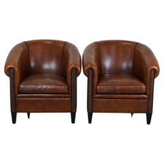 Set of 2 coveted sheepskin leather club armchairs with a beautiful appearance