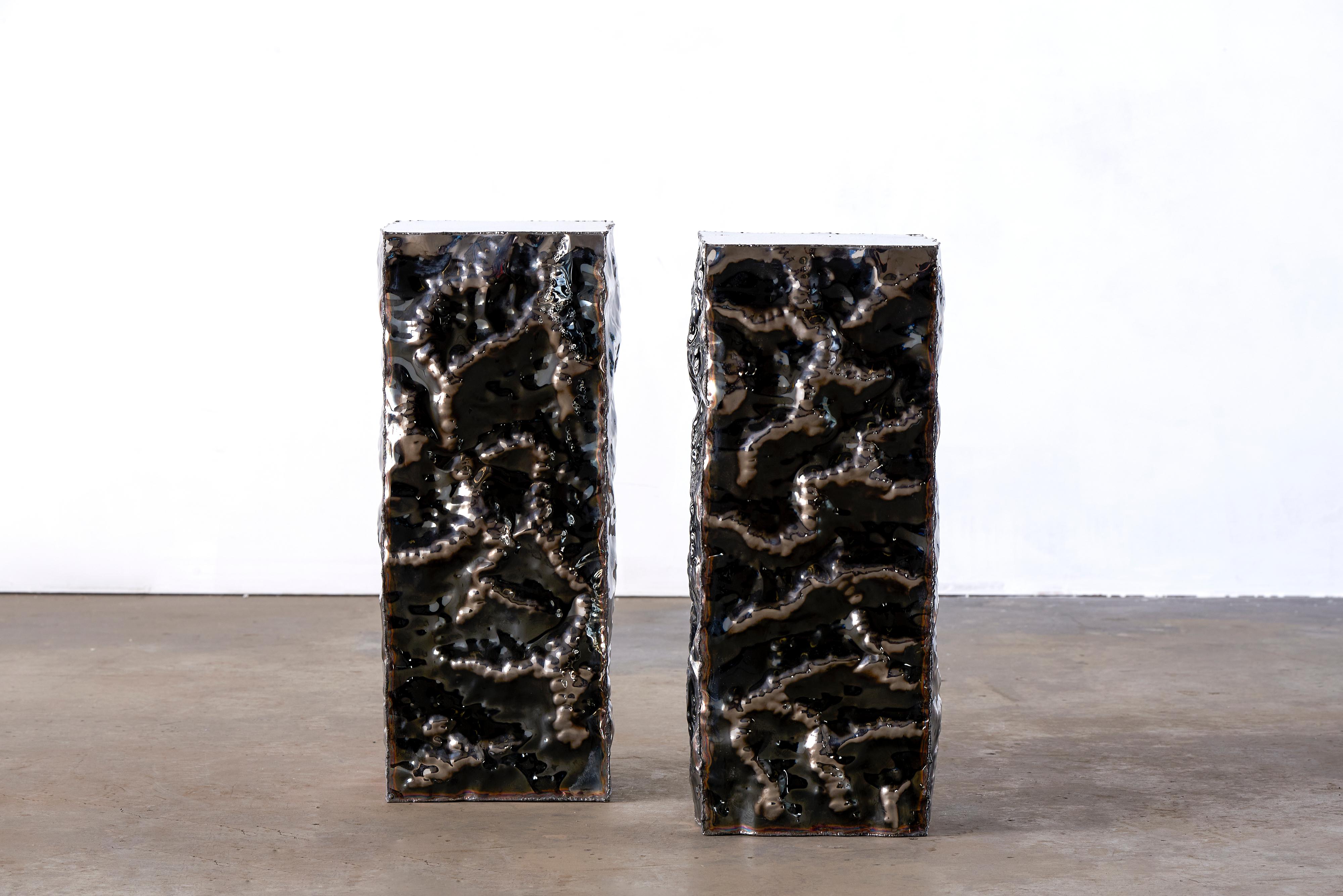 Set of 2 crinkle plinths by Michael Gittings Studio
Dimensions: D 30 x W 30 x H 70 cm
Materials: Mirror polished stainless steel

Michael Gittings
Melbourne based designer Michael Gittings aims to
Challenge pre-conceptions around furniture,