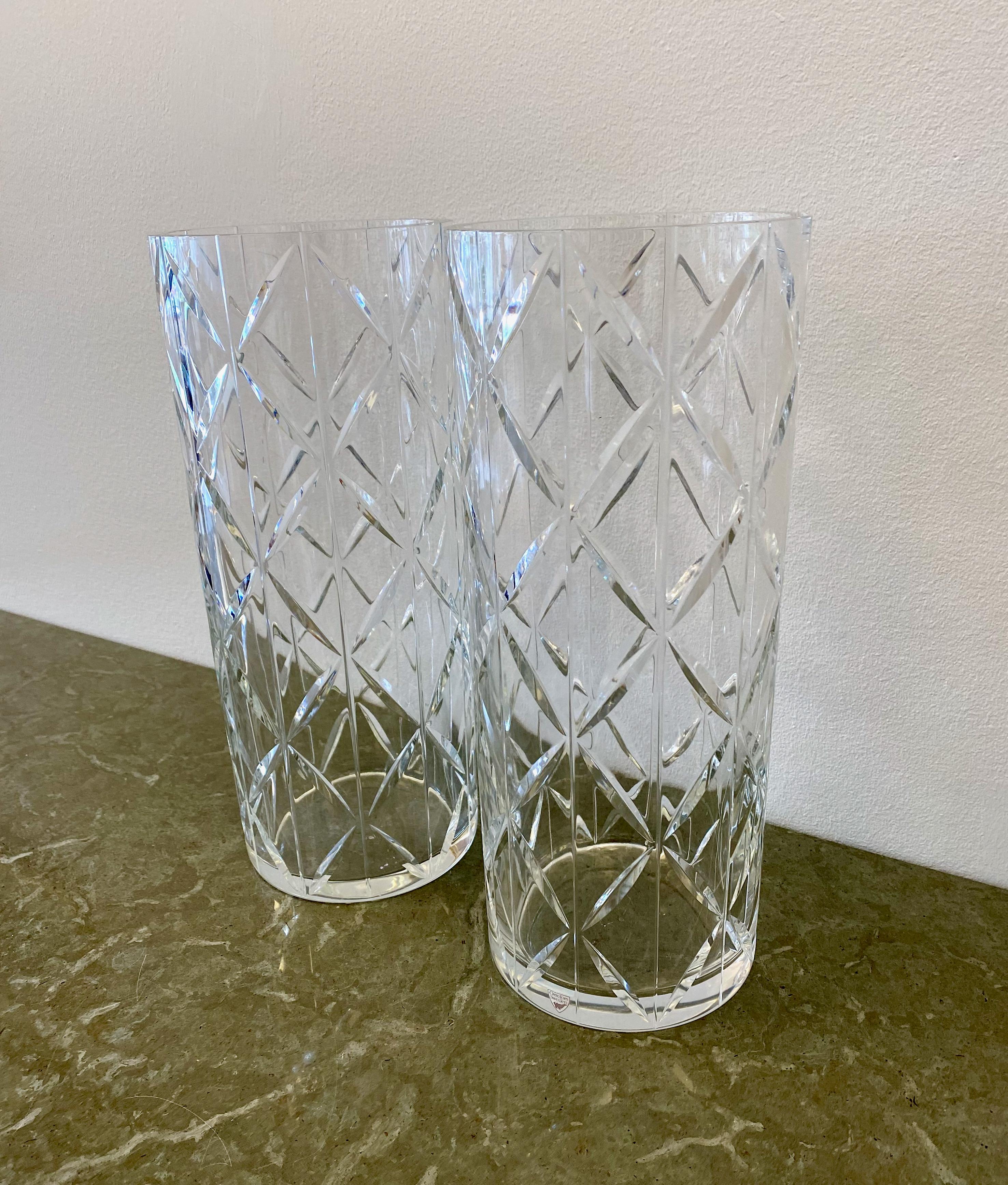Set of two large crystal vases designed by Ingegerd Råman for Orrefors.

Ingegerd Råman was born in Stockholm in 1943. She trained first under Carl Malmsten at Capellagården in Öland, and later at the University College of Arts, Crafts and Design in