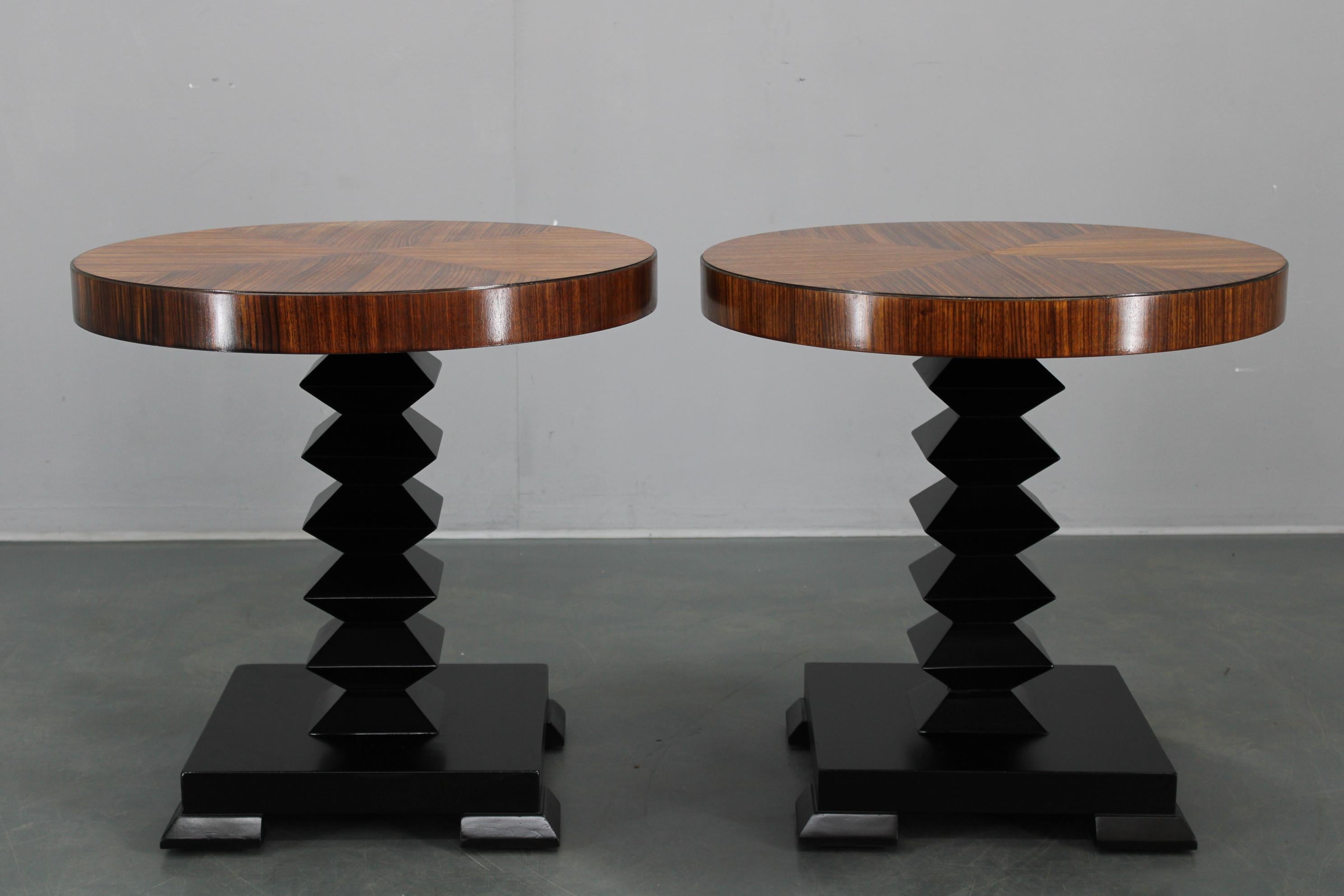 Description
Distinctive set of two side tables crafted in Czechoslovakia in the 1980s, designed in cubist style. Each table features a round, patterned veneer top (oiled finish) and lacquered solid wood pedestal base, with geometric profiles