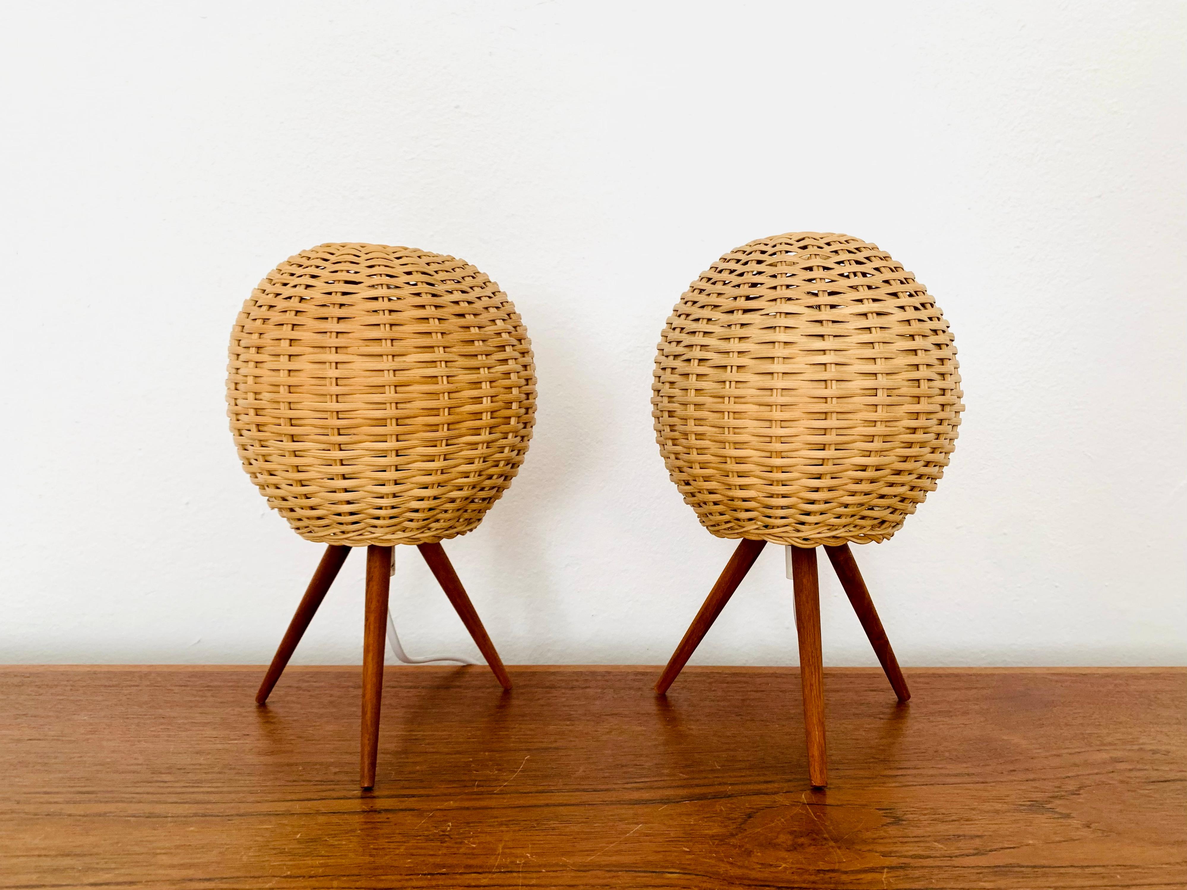 Wonderful Danish table lamps from the 1950s.
Extraordinary design with a fantastically comfortable look.
The rattan lampshades create a cozy light.
Beautiful three-legged teak feet.

The price refers to 2 lamps.

Condition:

Very good
