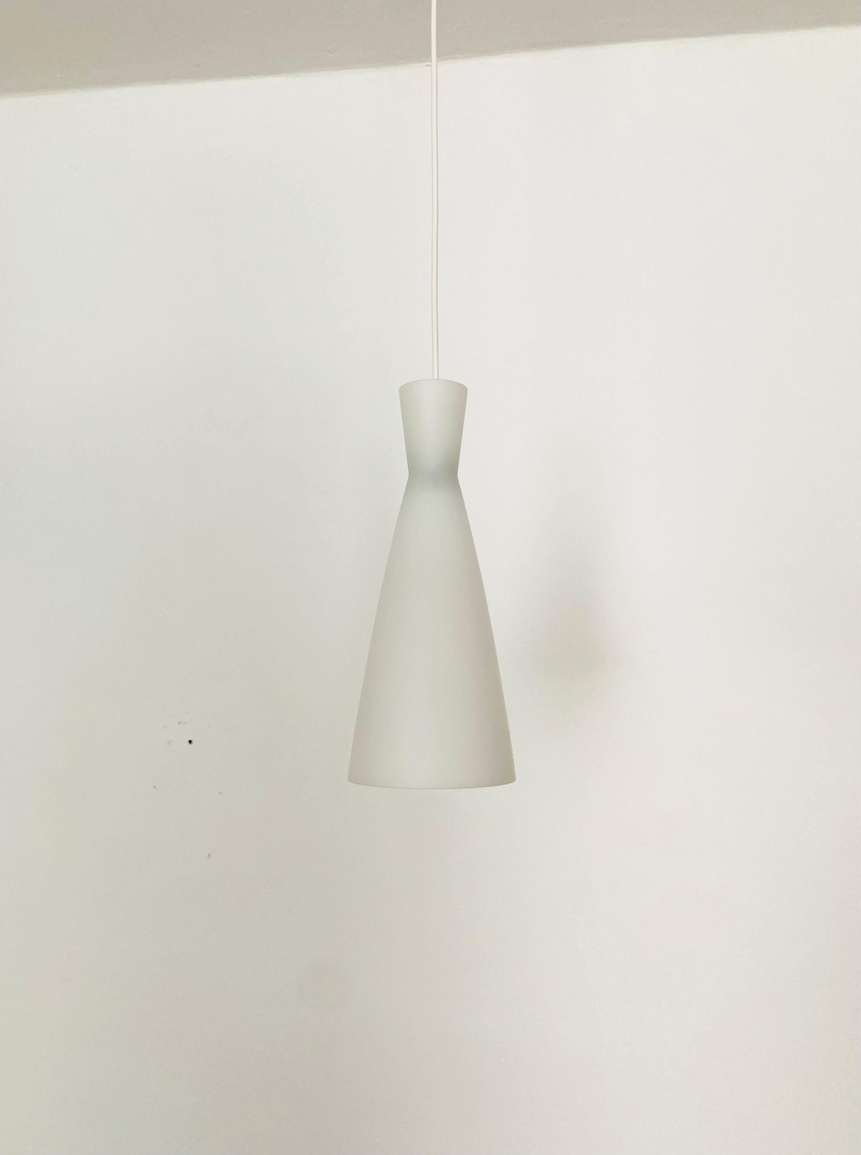 Wonderful pendant lamps from the 1950s.
Beautiful contemporary design.
Extremely beautiful lighting atmosphere with both direct and indirect light.

Manufacturer: Peill and Putzler
Design: Aloys Gangkofner

Condition:

Very good vintage condition
