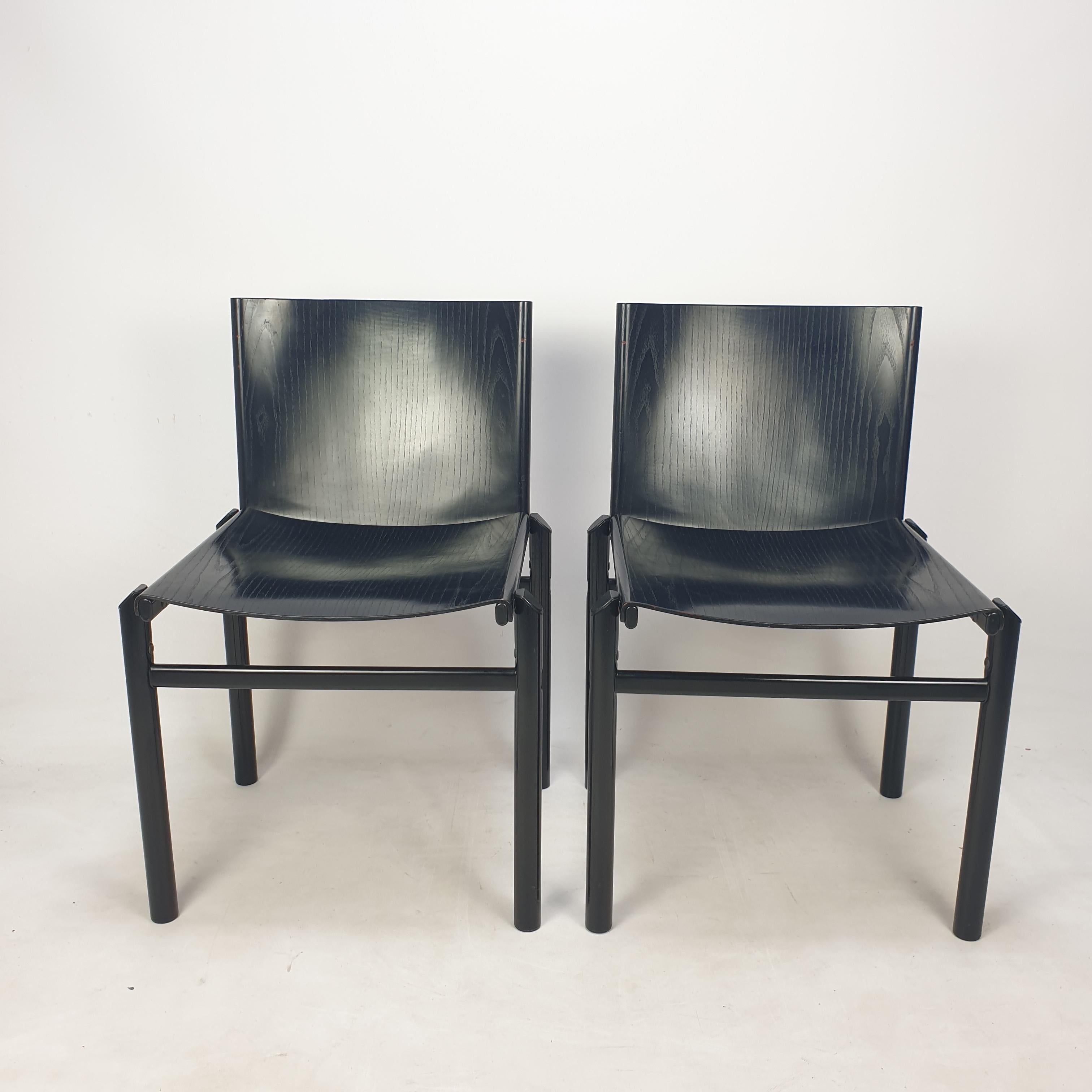 Rare set of 2 dining chairs by Afra & Tobia Scarpa, Italy, 1970's. 

A minimal and striking design with strong graphic lines and interesting details resulting in an architectural appearance. 
The simple but solid frames are constructed out of black