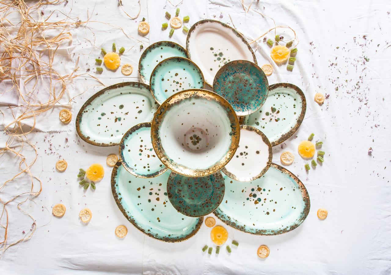 Hand painted in Italy from the finest porcelain, this Michelangelo Charger is material and earthy, like the great Renaissance Master's work. It conveys classical beauty and elegance. The green enamelled shade fades as it moves away from the rim