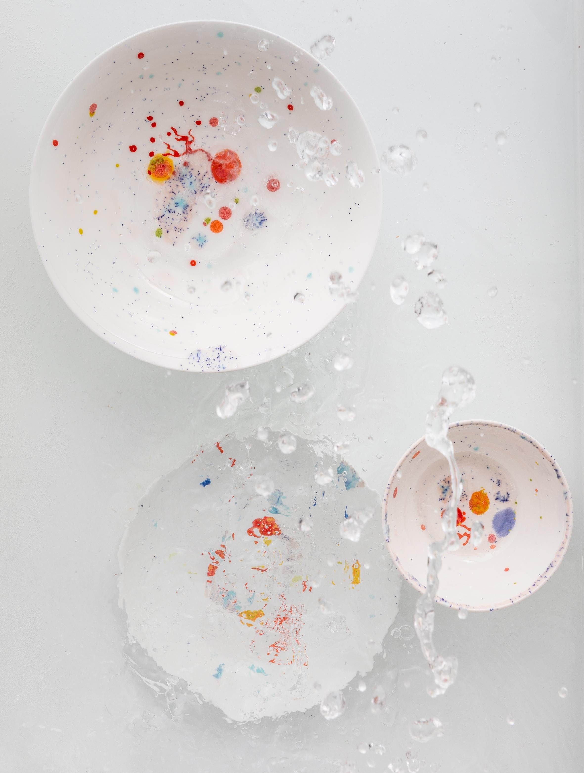 Handcrafted in Italy from the finest porcelain, these white seabed dinner coupe plates have corals lying on a bright bottom surrounded by mysterious multicolored gems floating amid brushes of light pink sand sprinkled with black dots.

Set of 2