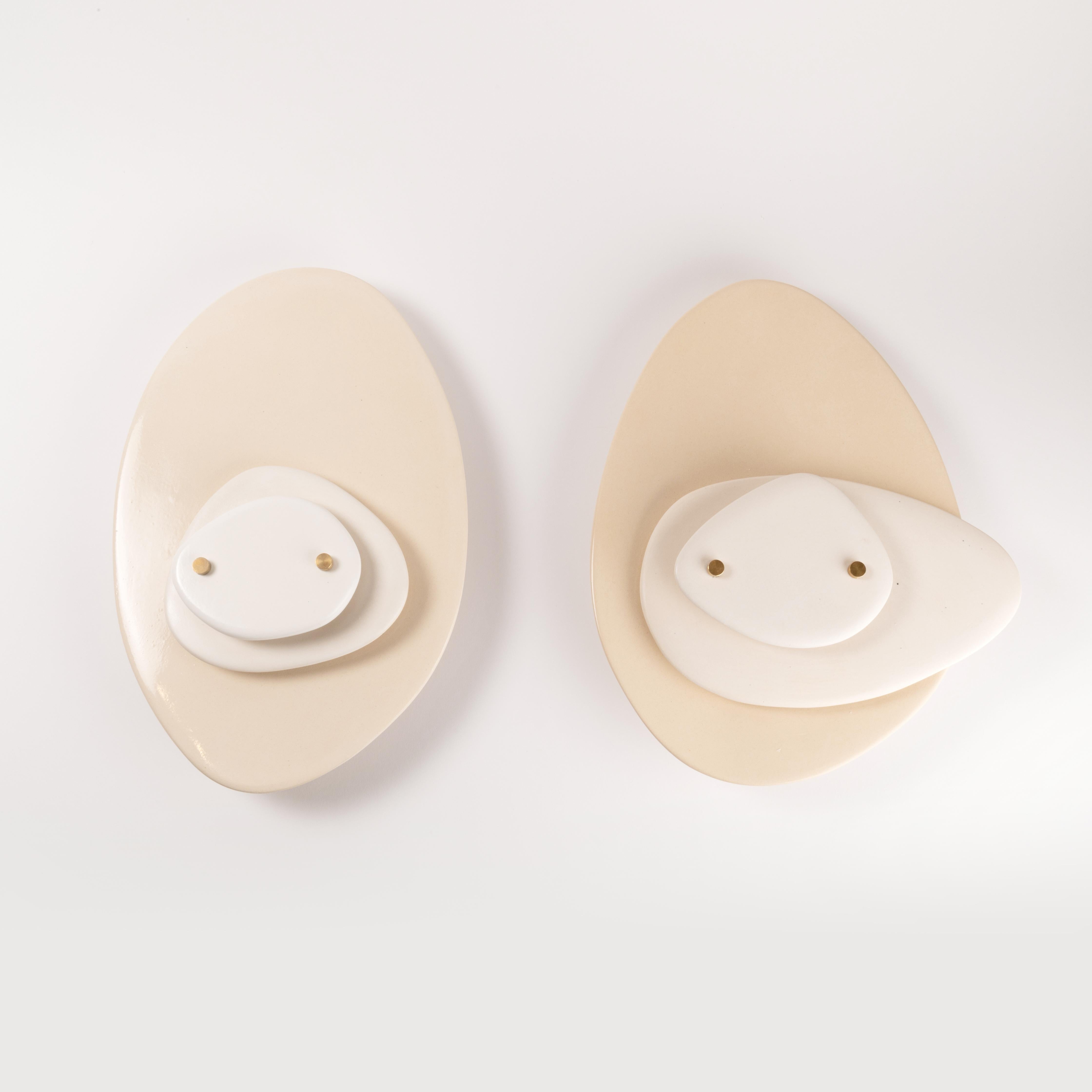 Set of 2 disk wall sconces by Elsa Foulon
Dimensions: D 34 x H 25 cm 
Materials: Ceramic, brass
Unique Piece

All our lamps can be wired according to each country. If sold to the USA it will be wired for the USA for instance.

Elsa Foulon,
