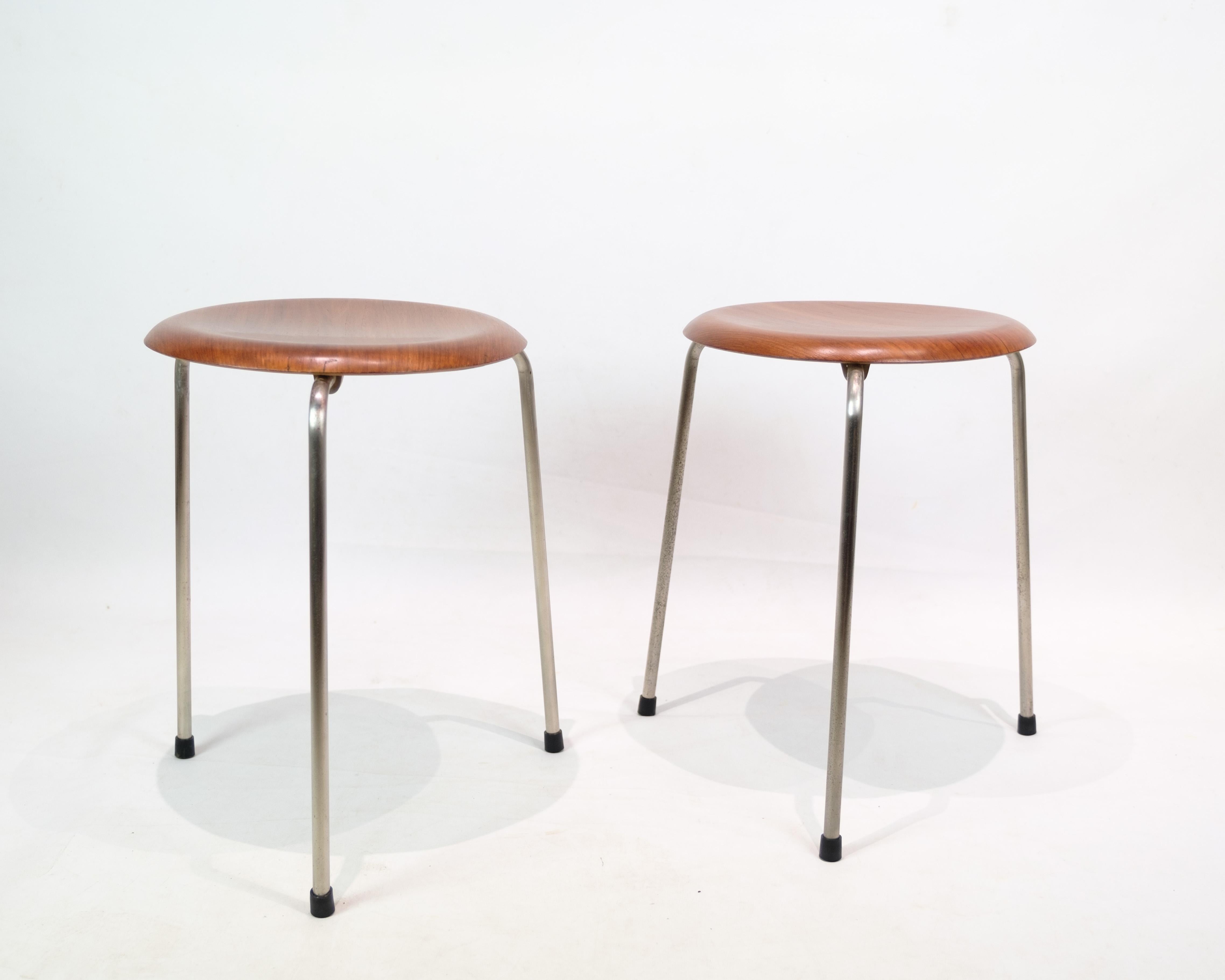 Set of 2 Dot stools, model 3170, designed by Arne Jacobsen and produced by Fritz Hansen in the 1950s. The stools are made of teak, which gives them a warm and classic look. The Dot stool is an example of Jacobsen's minimalist and functional design