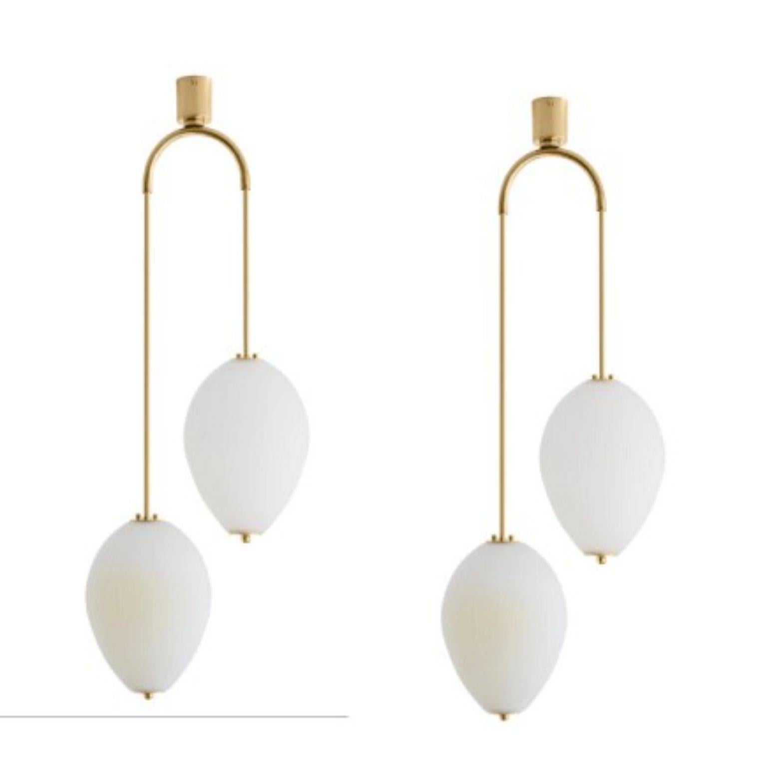 Double chandelier China 10 by Magic Circus Editions
Dimensions: H 121.5 x W 44.3 x D 25.2 cm
Materials: Brass, mouth blown glass sculpted with a diamond saw
Colour: ivory

Available finishes: brass, nickel
Available colours: enamel soft white,