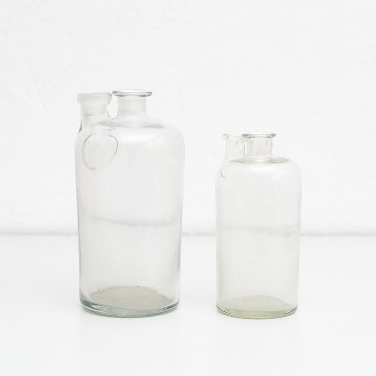 Set of 2 Early 20th Century Rustic Glass Bottles For Sale at 1stDibs
