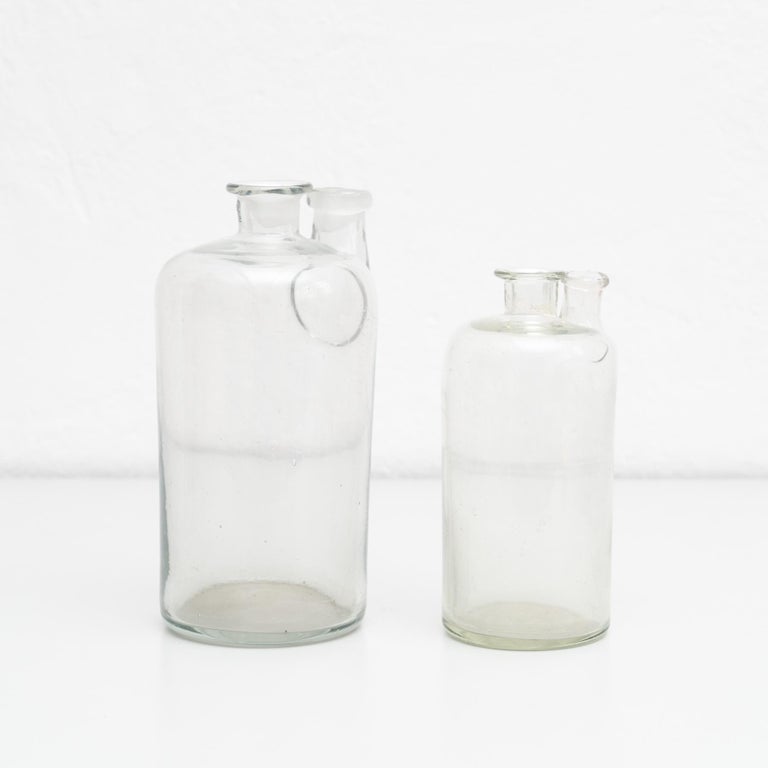 Set of 2 Early 20th Century Rustic Glass Bottles For Sale at 1stDibs