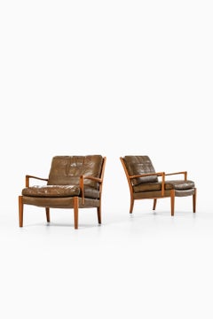 Set of 2 Easy Chairs in Leather and Walnut by Arne Norell, 1960s