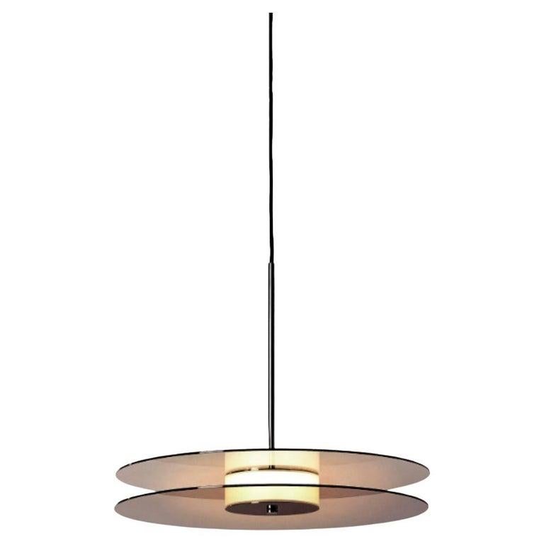 Set Of 2 Eclipse Pendant Light by Dechem Studio
Dimensions: D 50 x H 180 cm
Materials: Brass, Glass.

Inspired by the 1930s modernist design and Art Deco, Eclipse lamp is comprised of two metallized glass discs with a source of soft light behind