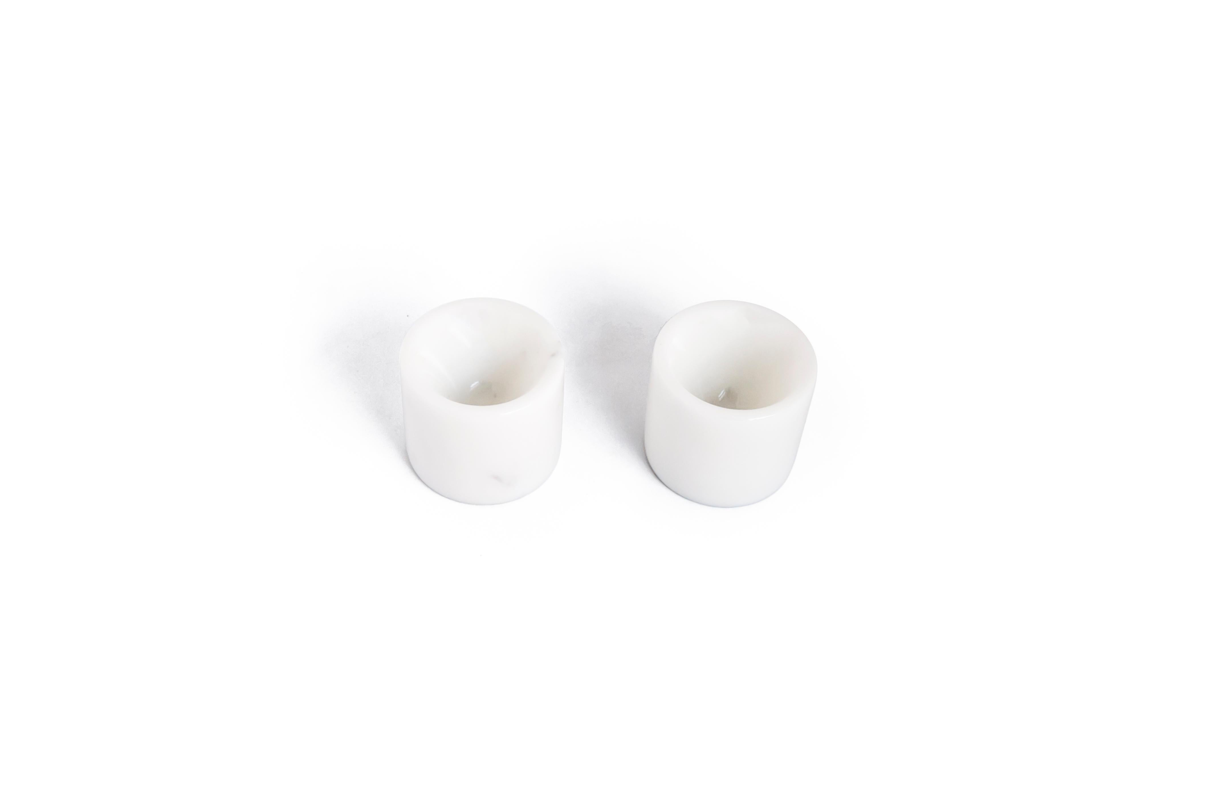 Set of 2 egg cups in white Carrara marble.

Each piece is unique and handmade by Italian artisans specialized over generations in processing the famous Carrara marble. Slight variations in shape, color and size are to be considered a guarantee of