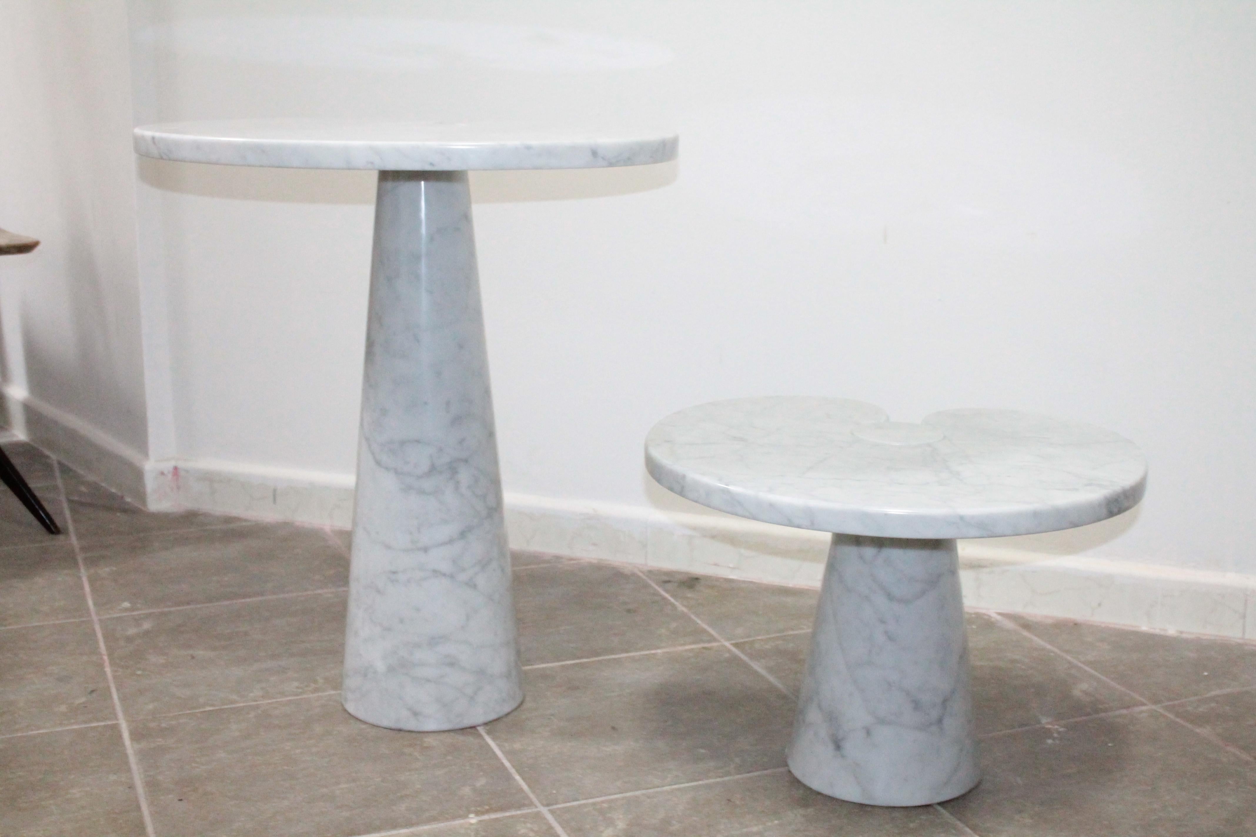 This set of Eros series coffee tables was designed by Angelo Mangiarotti for Skipper in Italy in 1971. It is made of solid white Carrara marble. The large table measures H 72 x W 66 x D 45 cm and the small one H 40 x W 54 x D 45.