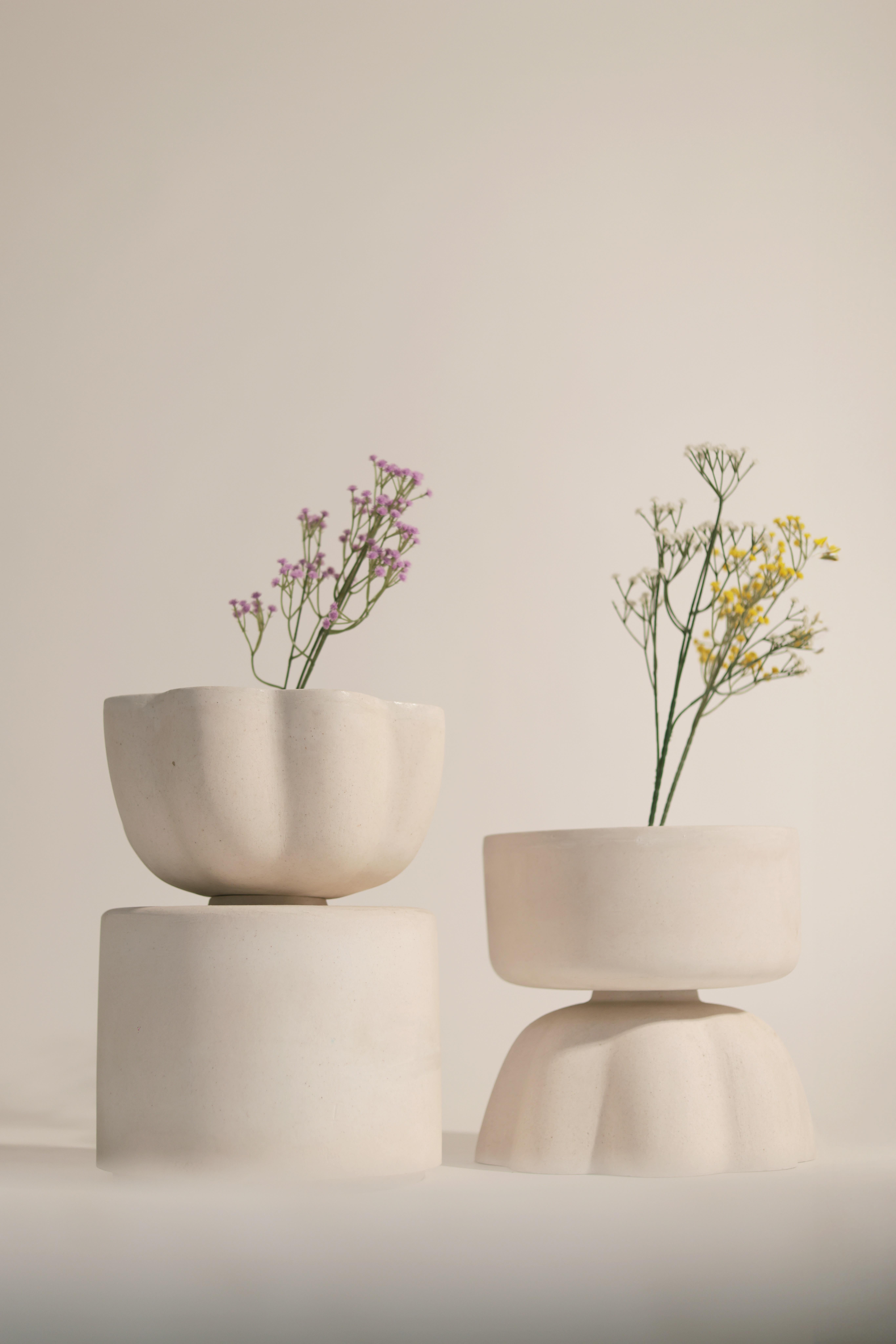 Set Of 2 Eternal Lotus Vases by Newblue
Unique Pieces
Dimensions: D 28 x W 28 x H 30/37 cm.
Materials: Patent-pending Newblue recycled ceramic material, recycled sanitary ware, recycled glass, quartz, and plant-based binders.

All ceramic furniture