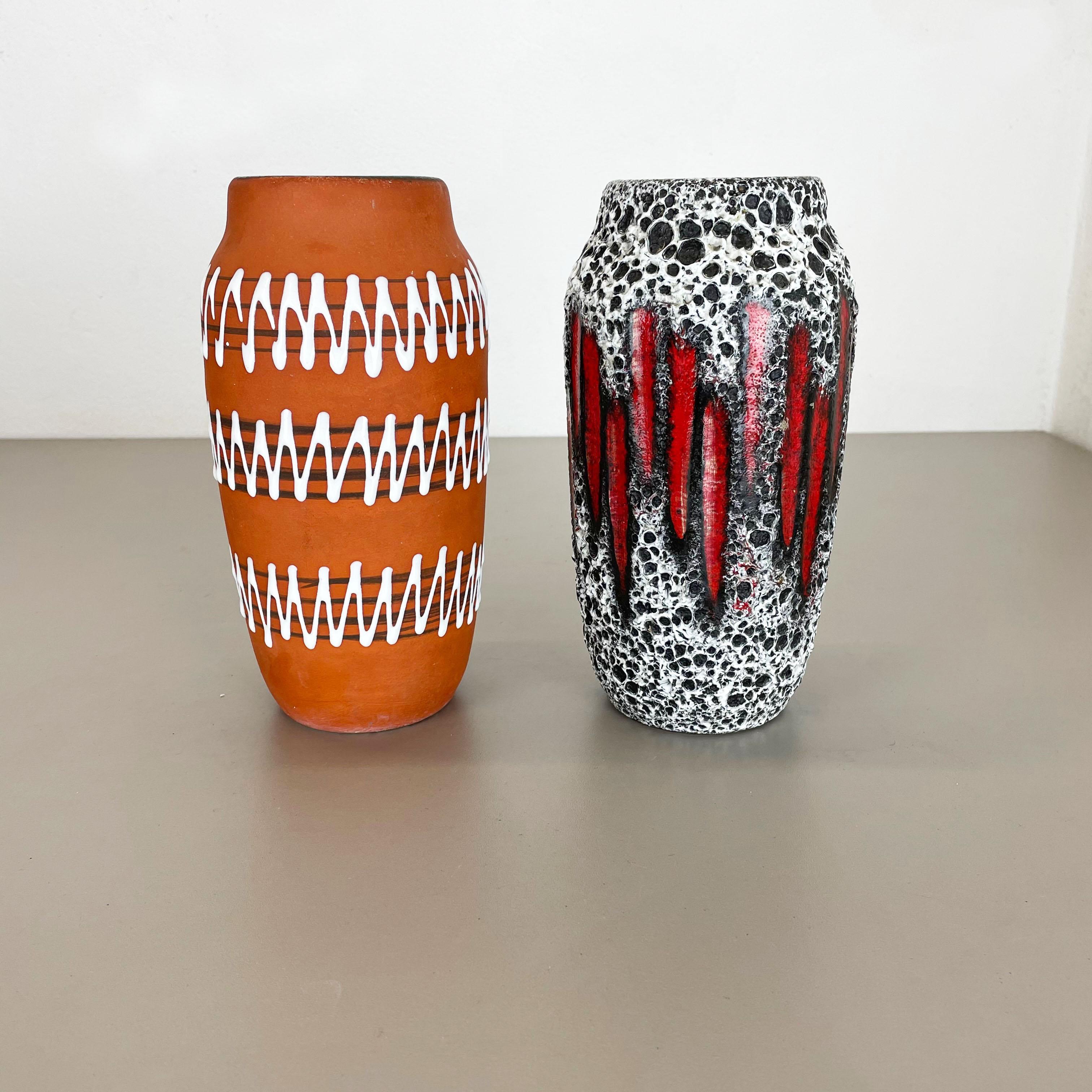 Article:

Fat lava art vase super rare zig zag set of 2


Producer:

Scheurich, Germany



Decade:

1970s




This original vintage vase set was produced in the 1970s in Germany by Scheurich. It is made of ceramic pottery in fat