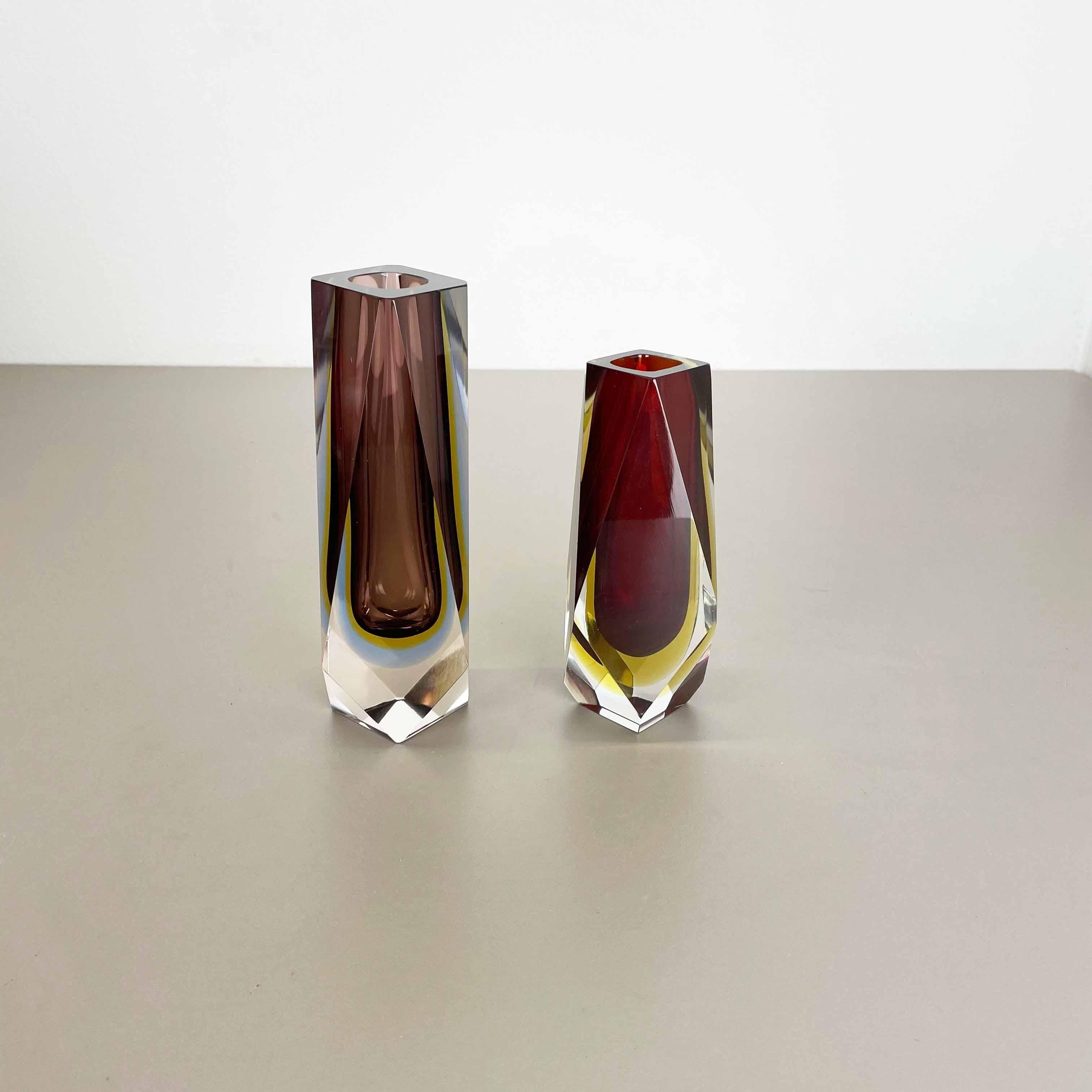 Article:

Murano glass vase set of 2


Origin:

Murano, Italy


Design:

Flavio Poli


Decade:

1970s



This original vintage glass vases set was designed by Flavio Poli and produced in the 1970s in Murano, Italy. It is made in Sommerso Technique