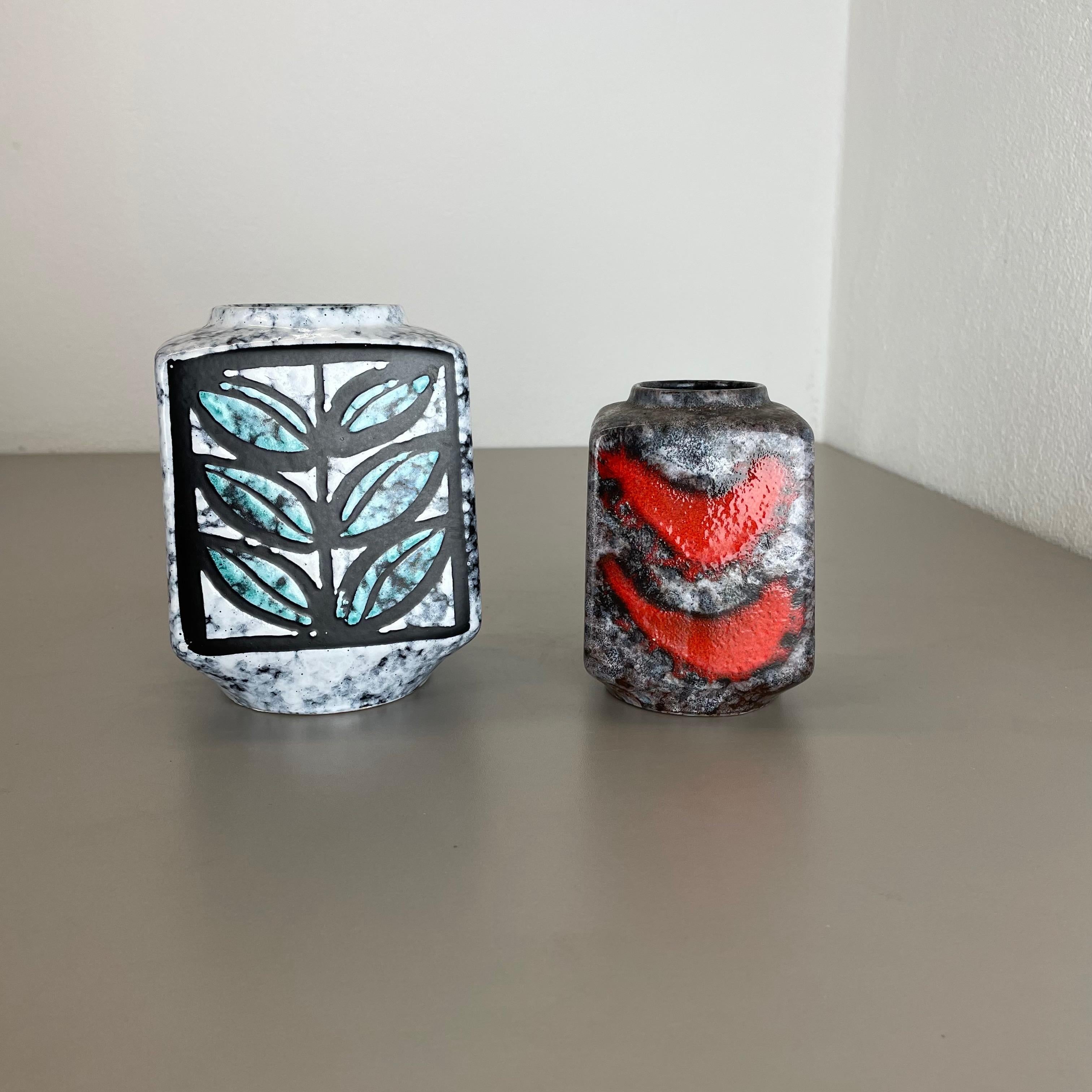 Article:

Ceramic pottery vase set of 2


Origin:

Germany, GDR


Producer:

Strehla, Germany GDR


Decade:

1970s


This original vintage pottery objects was designed and produced by Strehla in the 1970s in East Germany, GDR. It