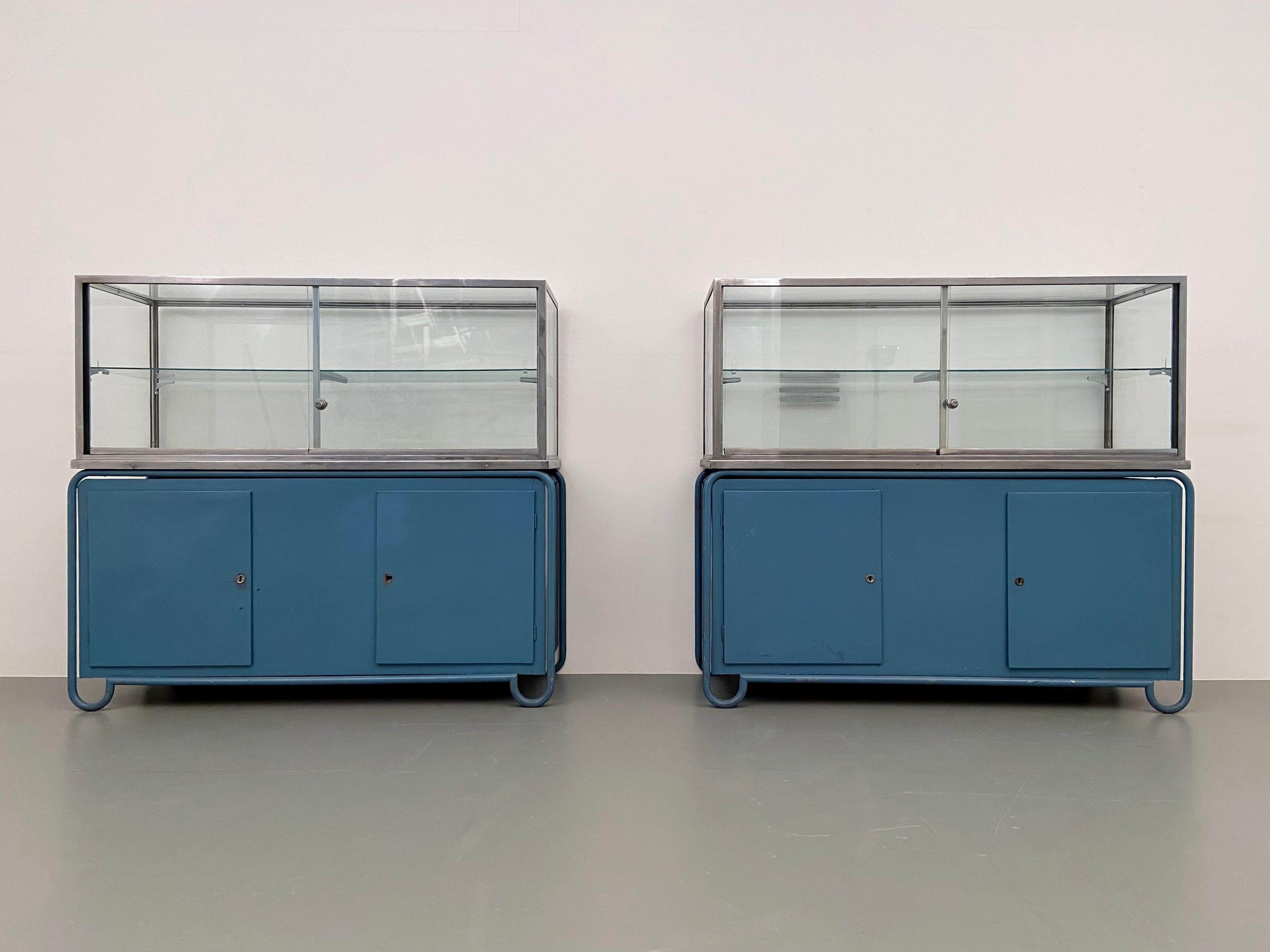 Set of 2 display cabinets from the Fondazione di Fiera Milano in original blue colour. 

The colour of the wood is the main reason why we bought them. The pleasant colour blue (deep sky translucent) and with great provenance too: Back in the days