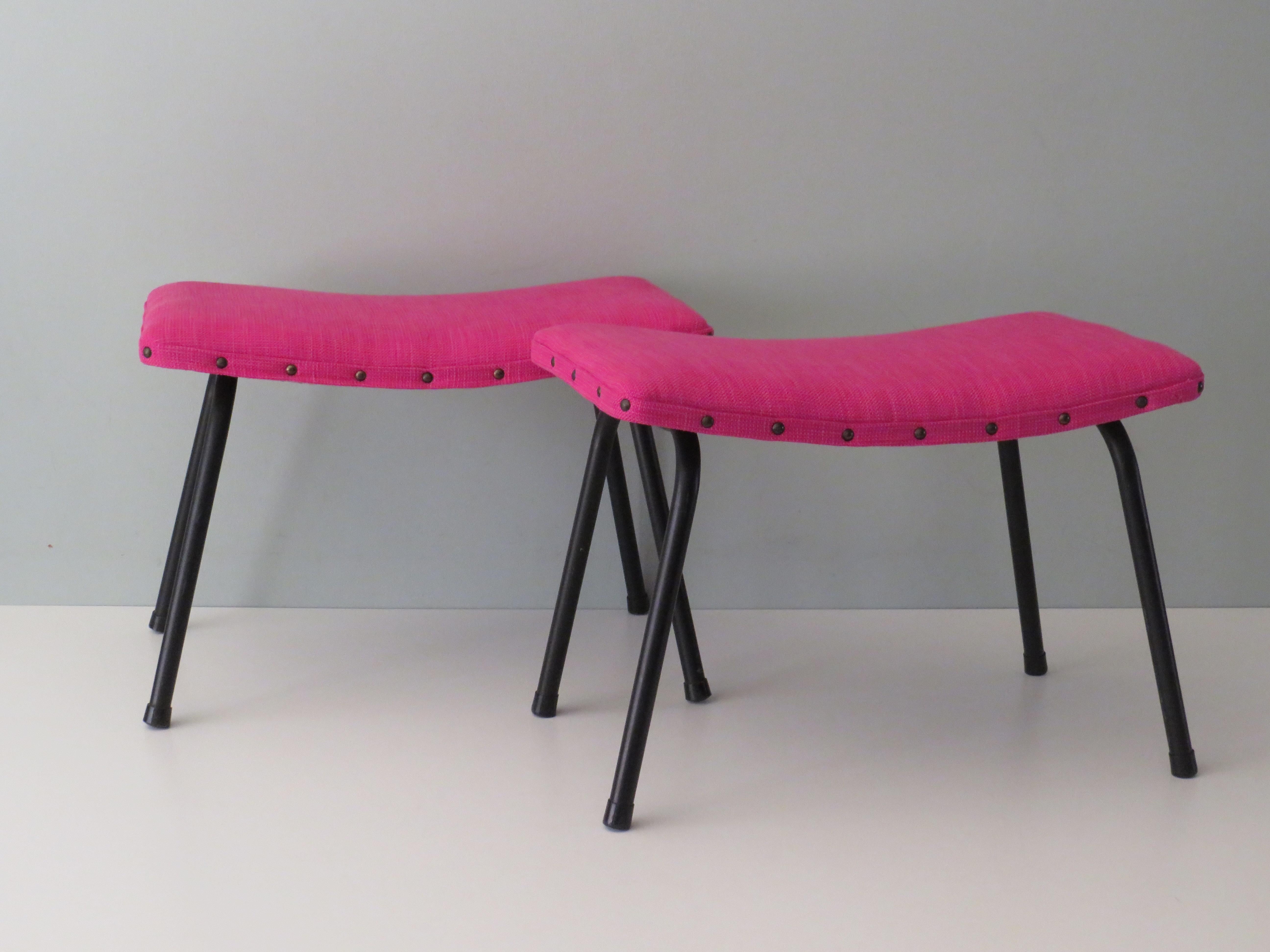 The footstools are designed by Guariche but produced by Sartha in Lier Belgium in 1966. They have a matt black lacquered tubular frame base and a new fuschia fabric upholstery.
They have been reupholstered both foam and fabric in the same way as