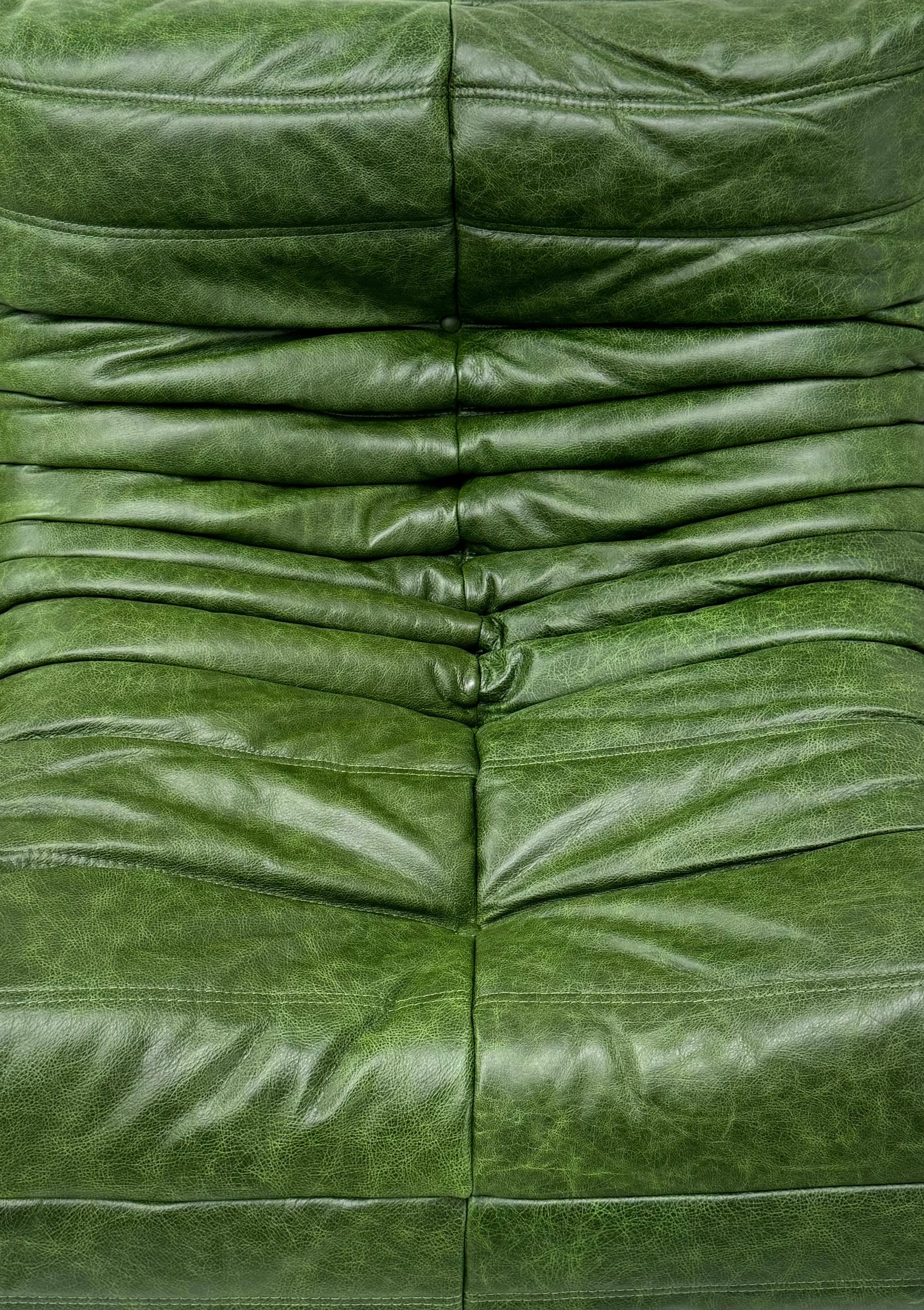 Mid-Century Modern Set of 2 French Togo Chairs in Green Leather by M. Ducaroy for Ligne Roset.